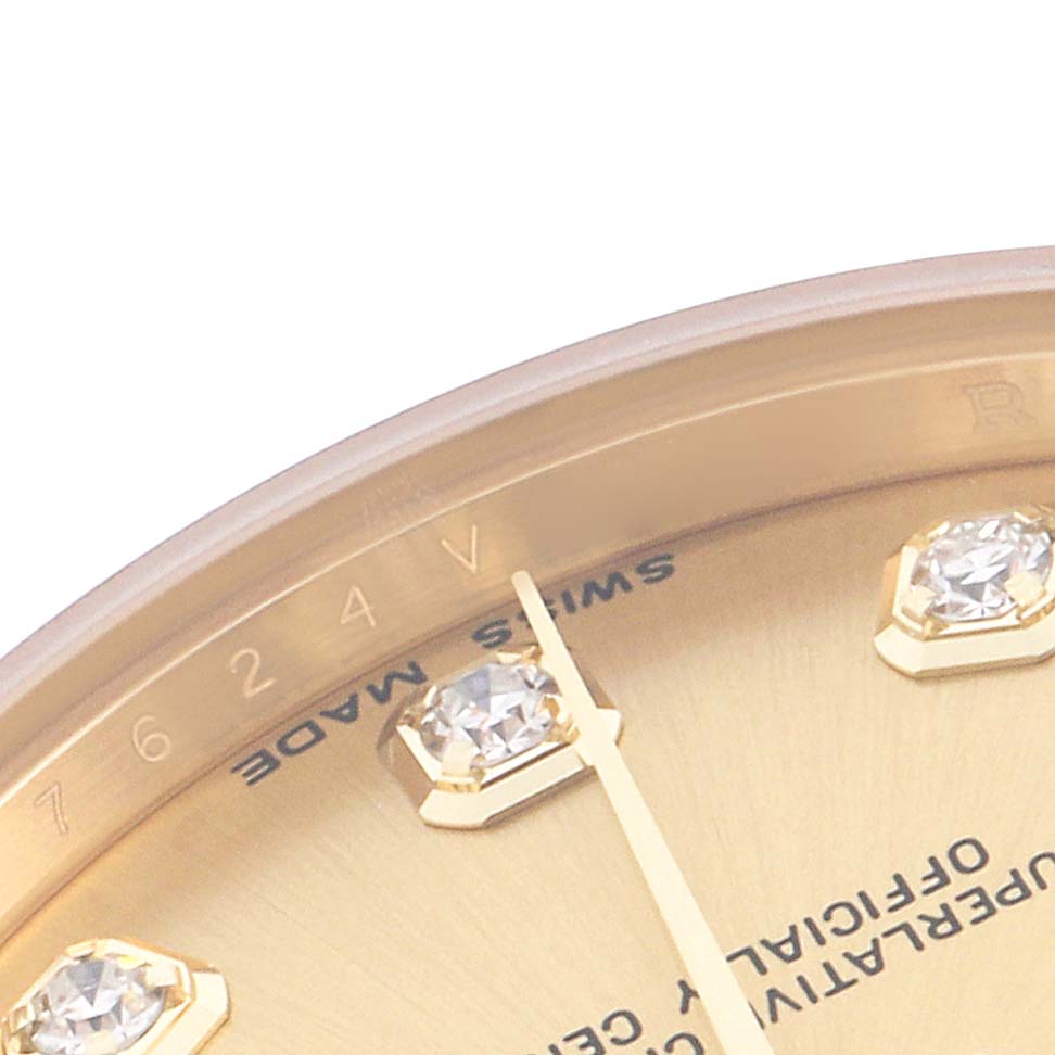 The image shows a close-up of the Rolex President 178238G Women
s Yellow Gold Champagne Dial 178238G Women
s Yellow Gold Champagne Dial watch
s dial, featuring part of the bezel, diamond hour markers, and minute hand.