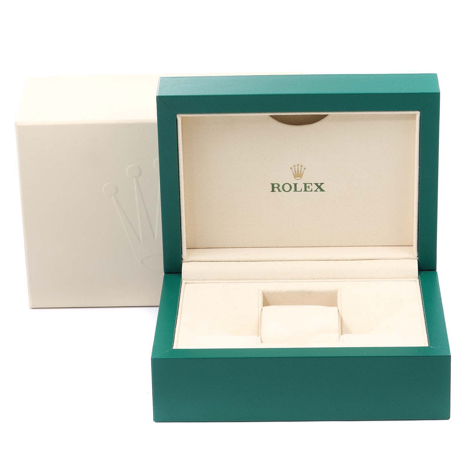 This image shows an open Rolex Submariner 14060 Men
s Stainless Steel Black Dial 14060 Men
s Stainless Steel Black Dial watch box, featuring green exterior and beige interior with the Rolex logo.