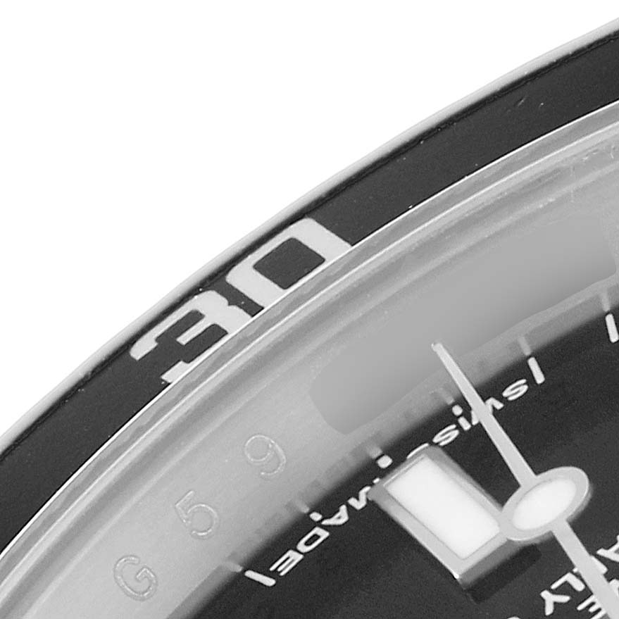 The image shows a close-up of the bezel and dial edge of a Rolex Submariner 14060 Men
s Stainless Steel Black Dial 14060 Men
s Stainless Steel Black Dial watch, focusing on the "30" minute marker and part of the minute hand.