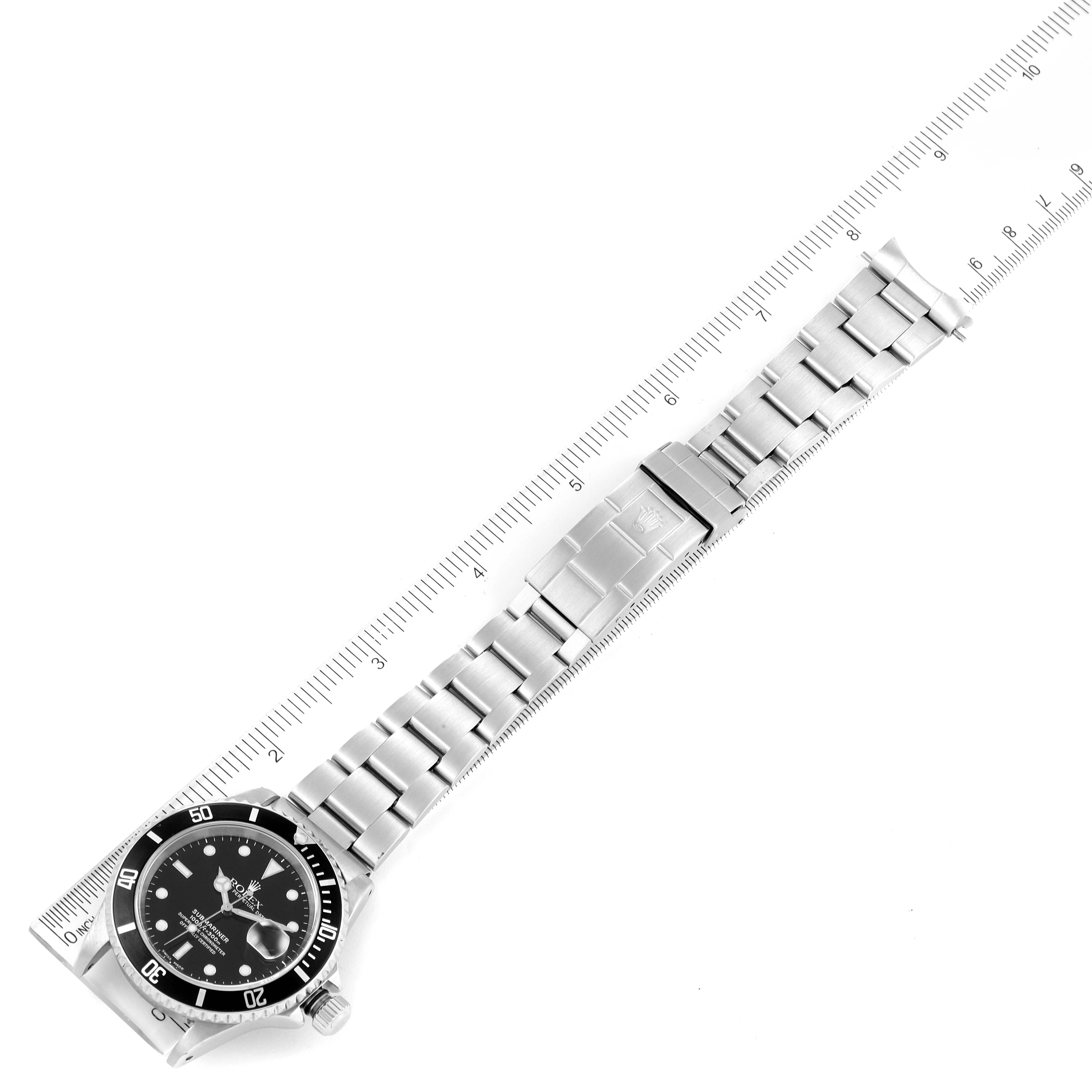 The Rolex Submariner 16610 Men
s Stainless Steel Black Dial 16610 Men
s Stainless Steel Black Dial watch is shown from a top-down angle, displaying its full length, bezel, dial, and bracelet.