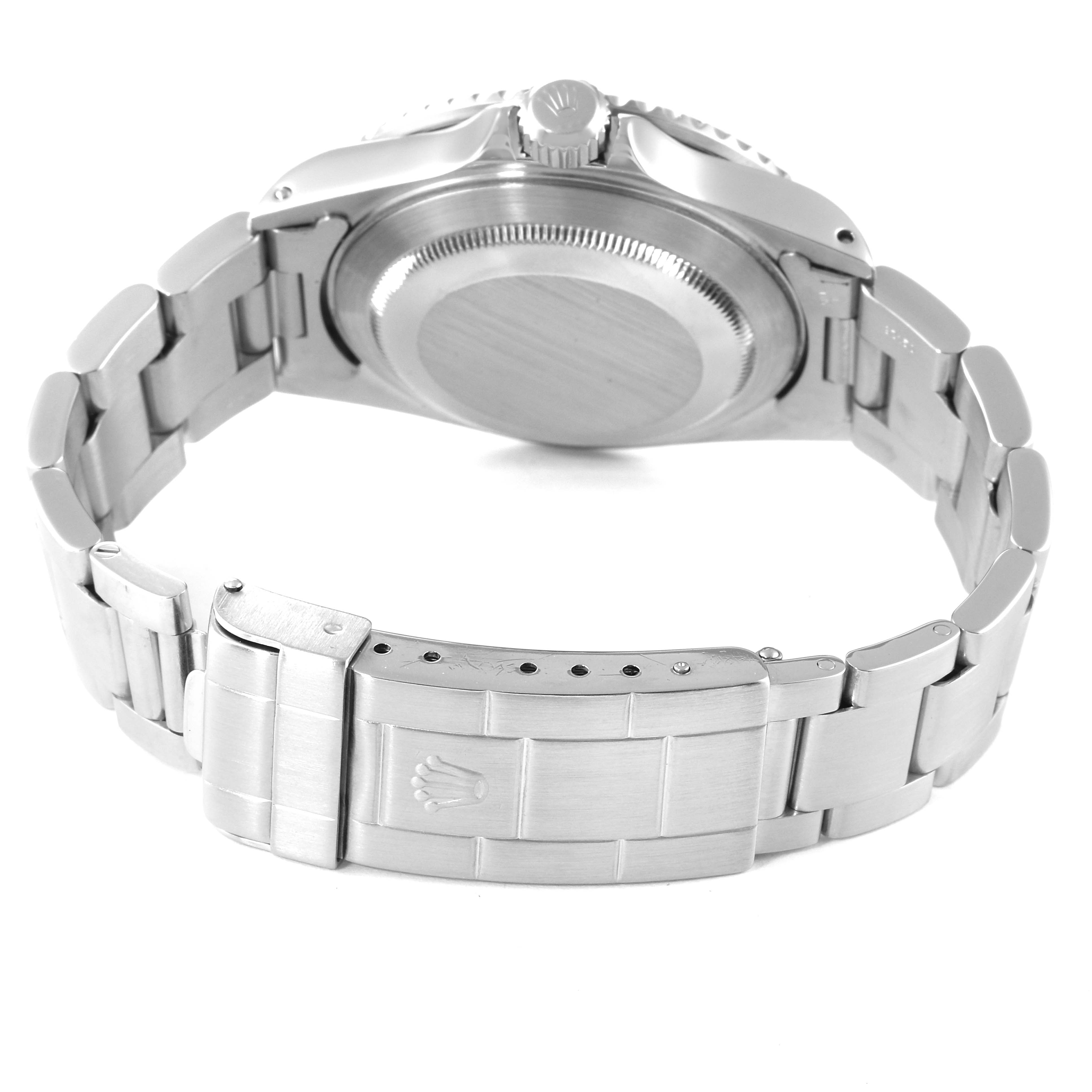 The image shows the back view of a Rolex Submariner 16610 Men
s Stainless Steel Black Dial 16610 Men
s Stainless Steel Black Dial watch, highlighting the case back and metal bracelet with clasp.