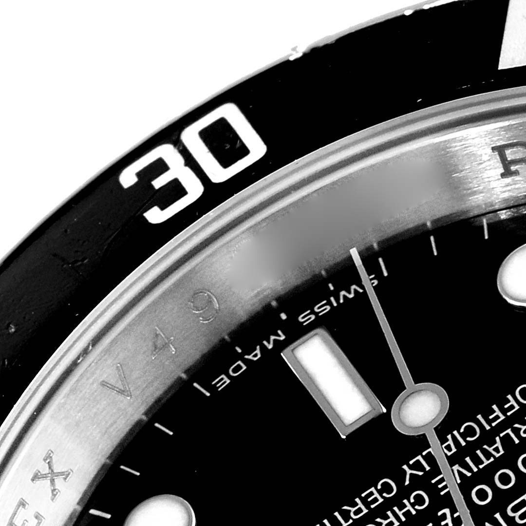The image shows a close-up of the bezel and part of the dial of a Rolex Submariner 16610 Men
s Stainless Steel Black Dial 16610 Men
s Stainless Steel Black Dial watch, specifically around the 30-minute mark.