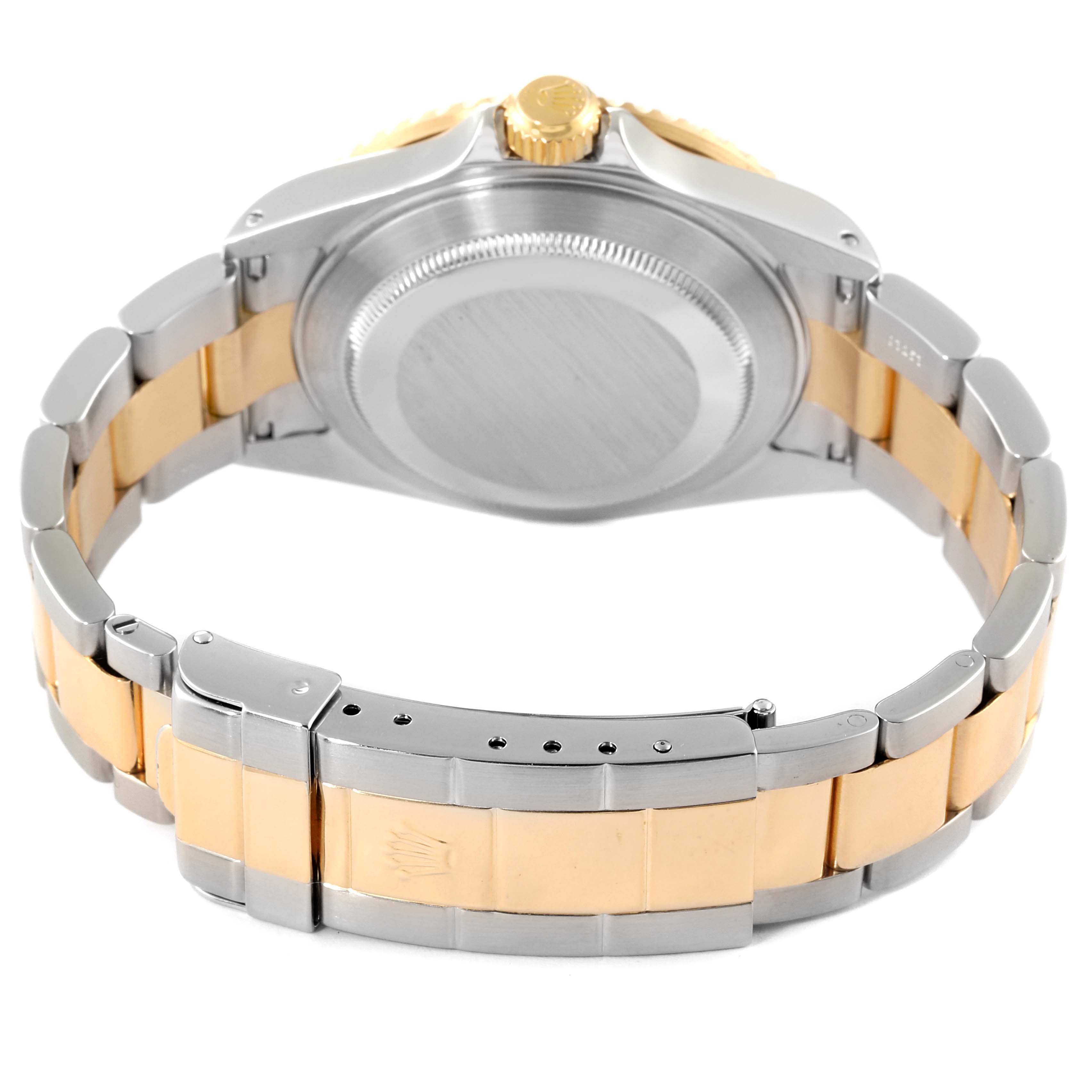 The image shows the back view of a Rolex Submariner 16613 Men
s Steel and Gold (two tone) Blue Dial 16613 Men
s Steel and Gold (two tone) Blue Dial, highlighting its two-tone bracelet and case back.