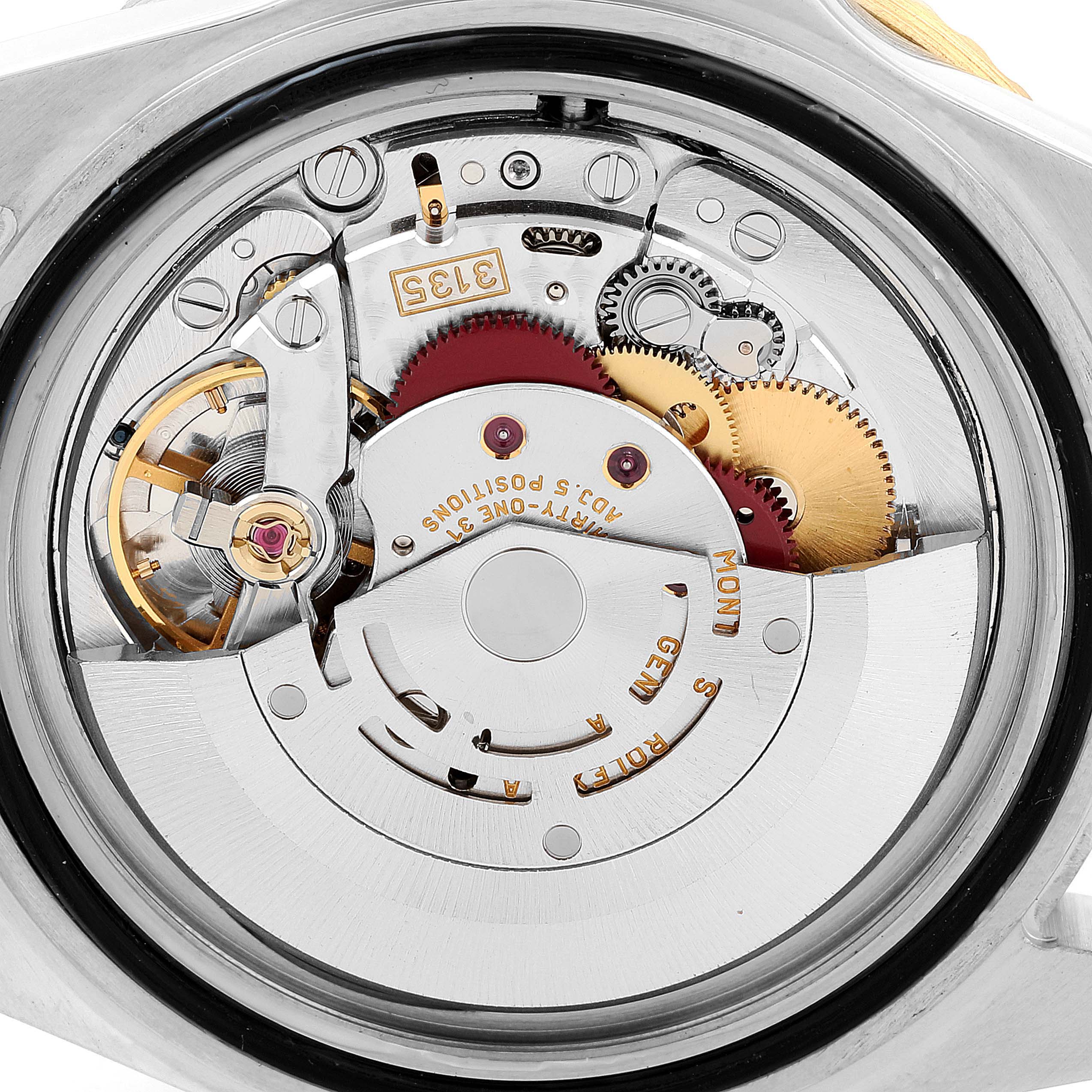 This image shows the intricate internal mechanism and movement of a Rolex Submariner 16613 Men
s Steel and Gold (two tone) Blue Dial 16613 Men
s Steel and Gold (two tone) Blue Dial watch viewed from the back.