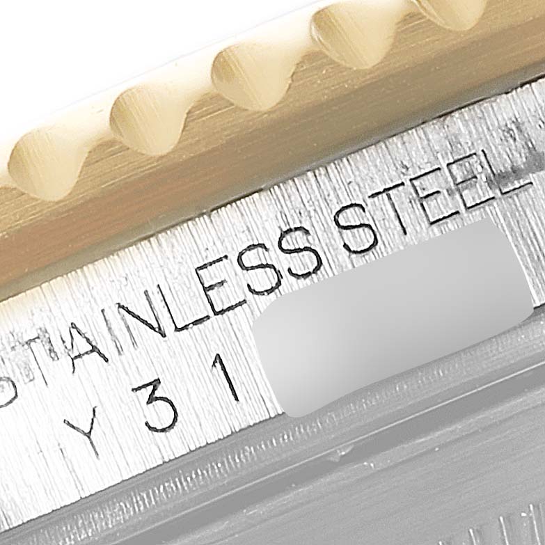 This close-up angle shows the engraved stainless steel inscription on the side of a Rolex Submariner 16613 Men
s Steel and Gold (two tone) Blue Dial 16613 Men
s Steel and Gold (two tone) Blue Dial.