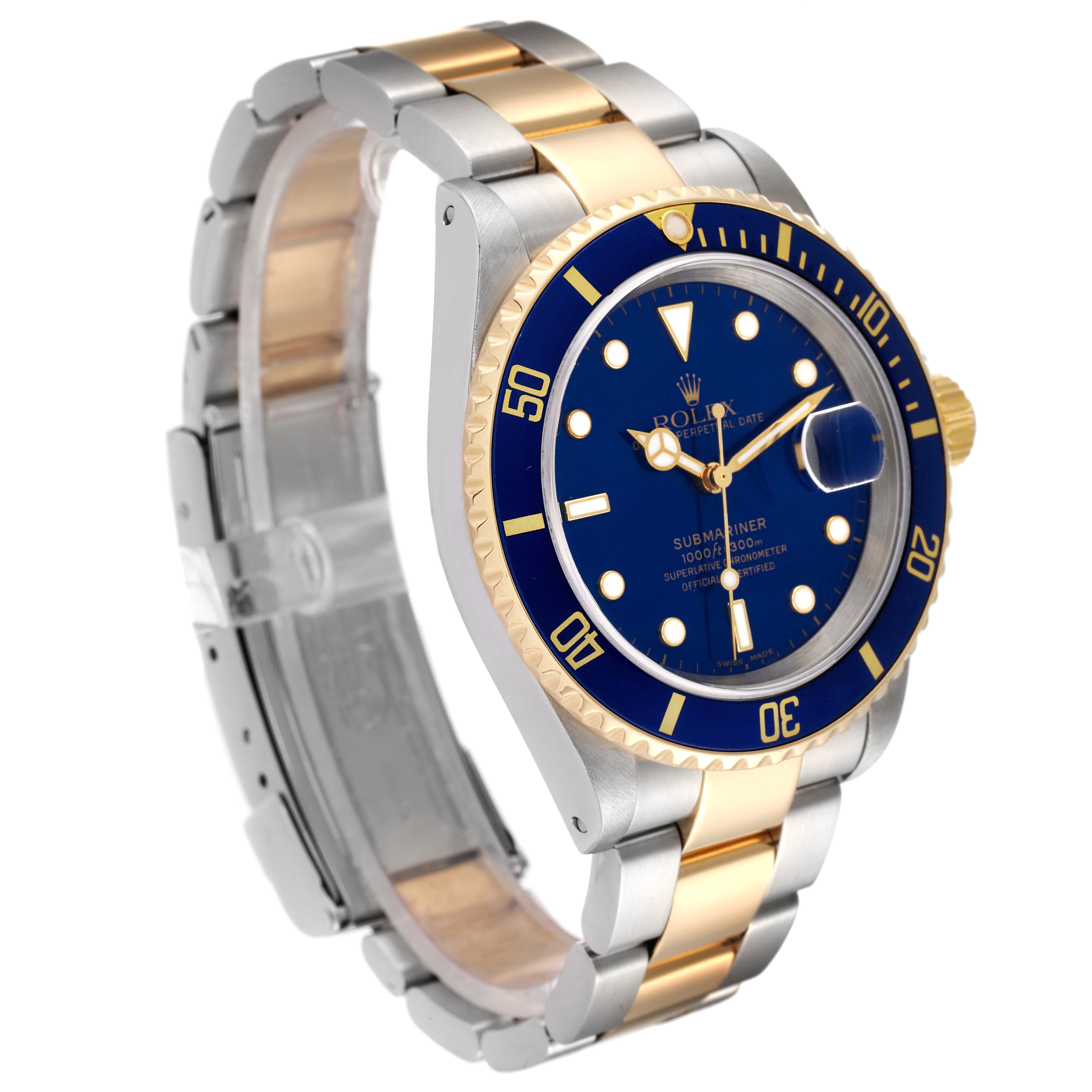 The image shows a Rolex Submariner 16613 Men
s Steel and Gold (two tone) Blue Dial 16613 Men
s Steel and Gold (two tone) Blue Dial watch at a slight angle, highlighting its blue dial, gold accents, and two-tone bracelet.