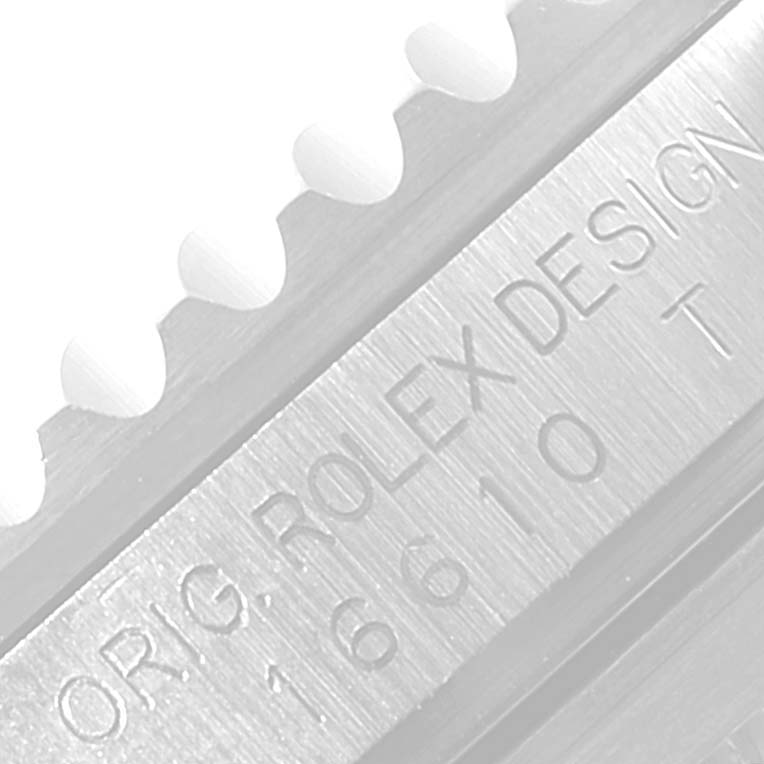 This image shows a close-up of the bezel and engraving on a Rolex Submariner 16610LV Men's Stainless Steel Black Dial 16610LV Men's Stainless Steel Black Dial model 16610.