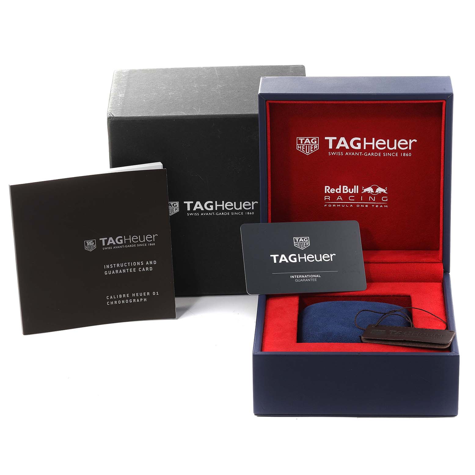 The image shows the Tag Heuer Carrera CAR2A1N.FT6100 Men's Stainless Steel Blue Dial CAR2A1N.FT6100 Men's Stainless Steel Blue Dial watch box, instruction manual, guarantee card, and a cushioned insert from a front angle.