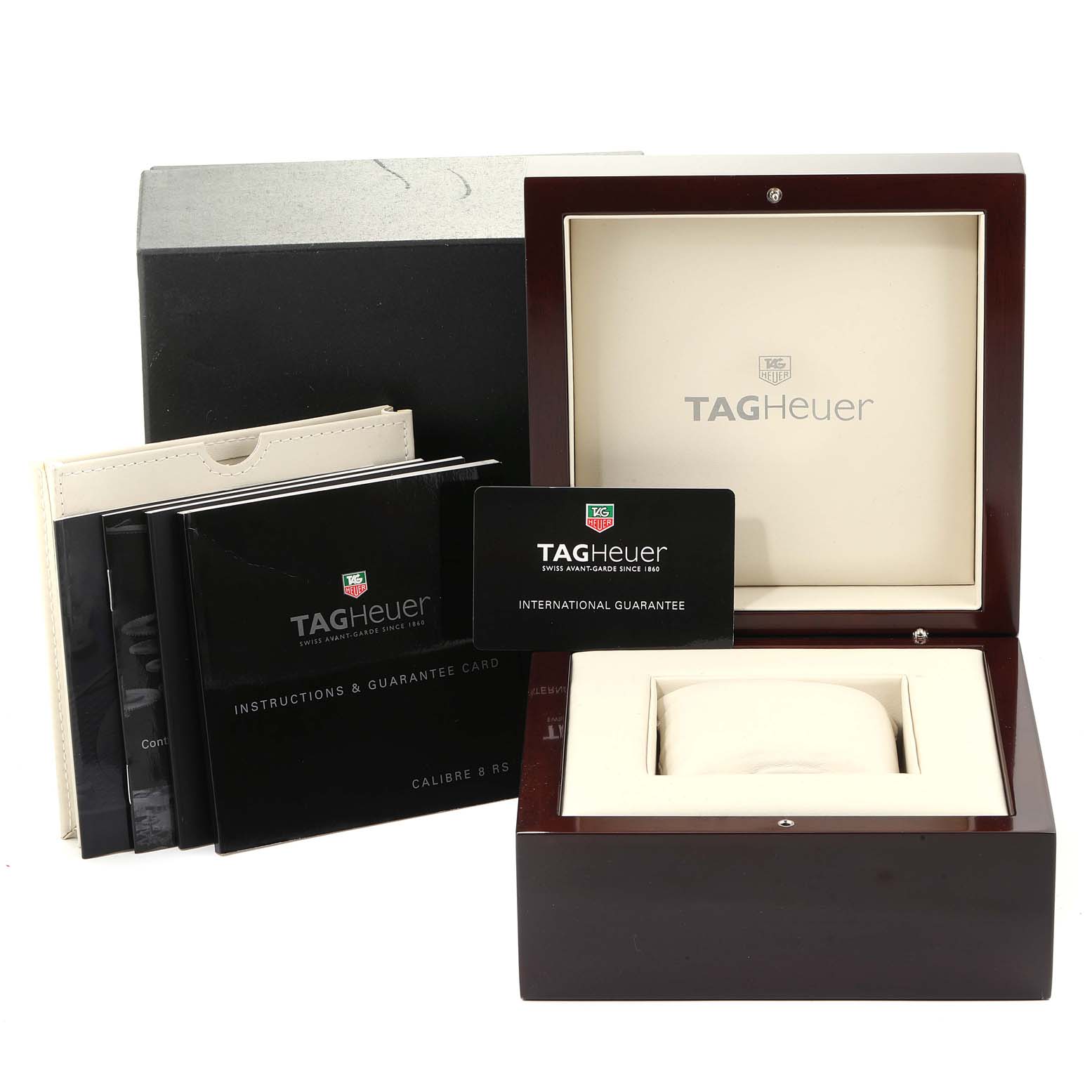 The image shows the packaging and accessories for a Tag Heuer Carrera WAV5112.BA0901 Men's Stainless Steel Silver Dial WAV5112.BA0901 Men's Stainless Steel Silver Dial model watch, including booklets and a guarantee card.