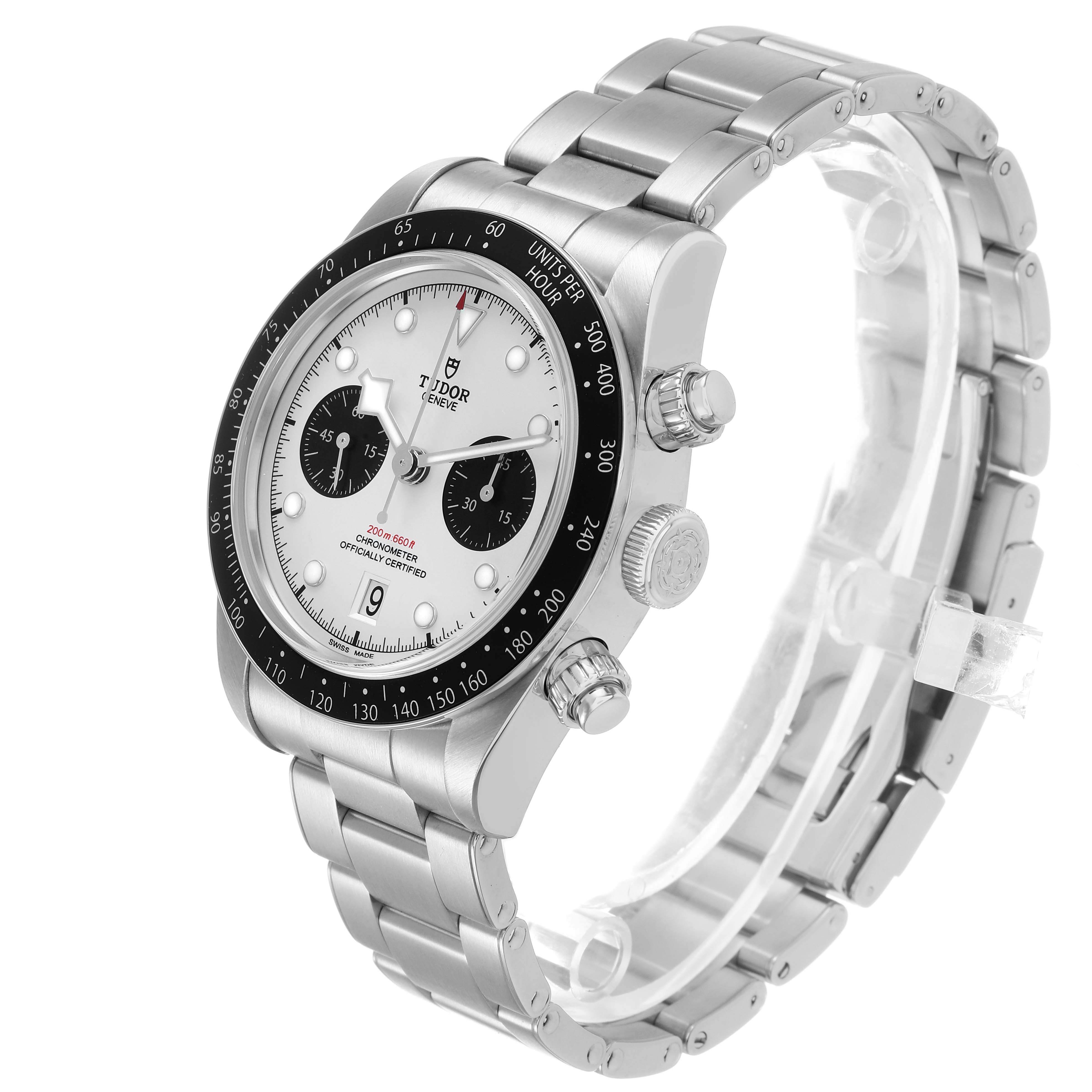 The Tudor Heritage Black Bay M79360N-0012 Men's Stainless Steel Silver Dial watch is shown at a three-quarter angle, highlighting the dial, bezel, and stainless steel bracelet.