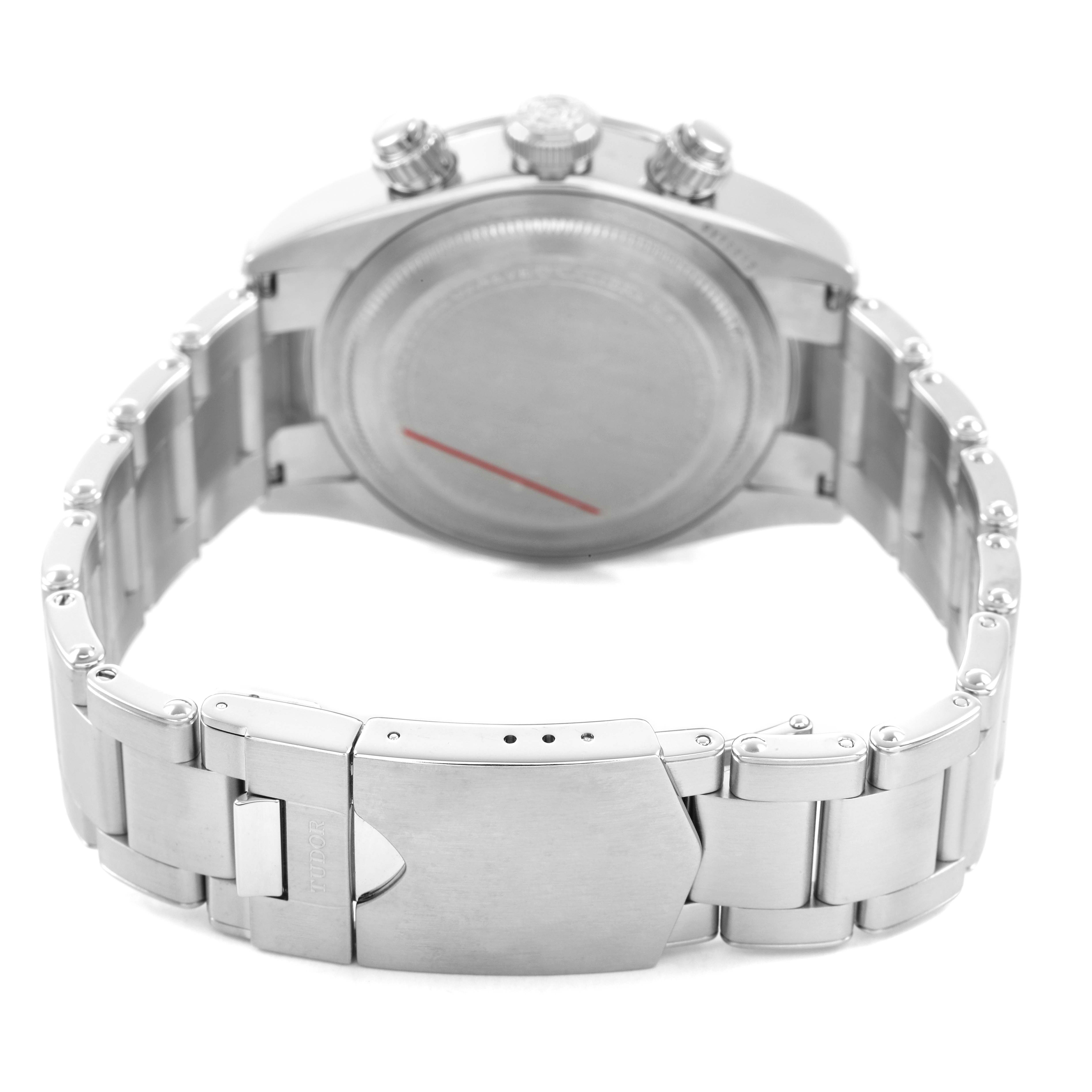 The Tudor Heritage Black Bay M79360N-0012 Men's Stainless Steel Silver Dial watch is shown from the back, highlighting the bracelet and clasp.
