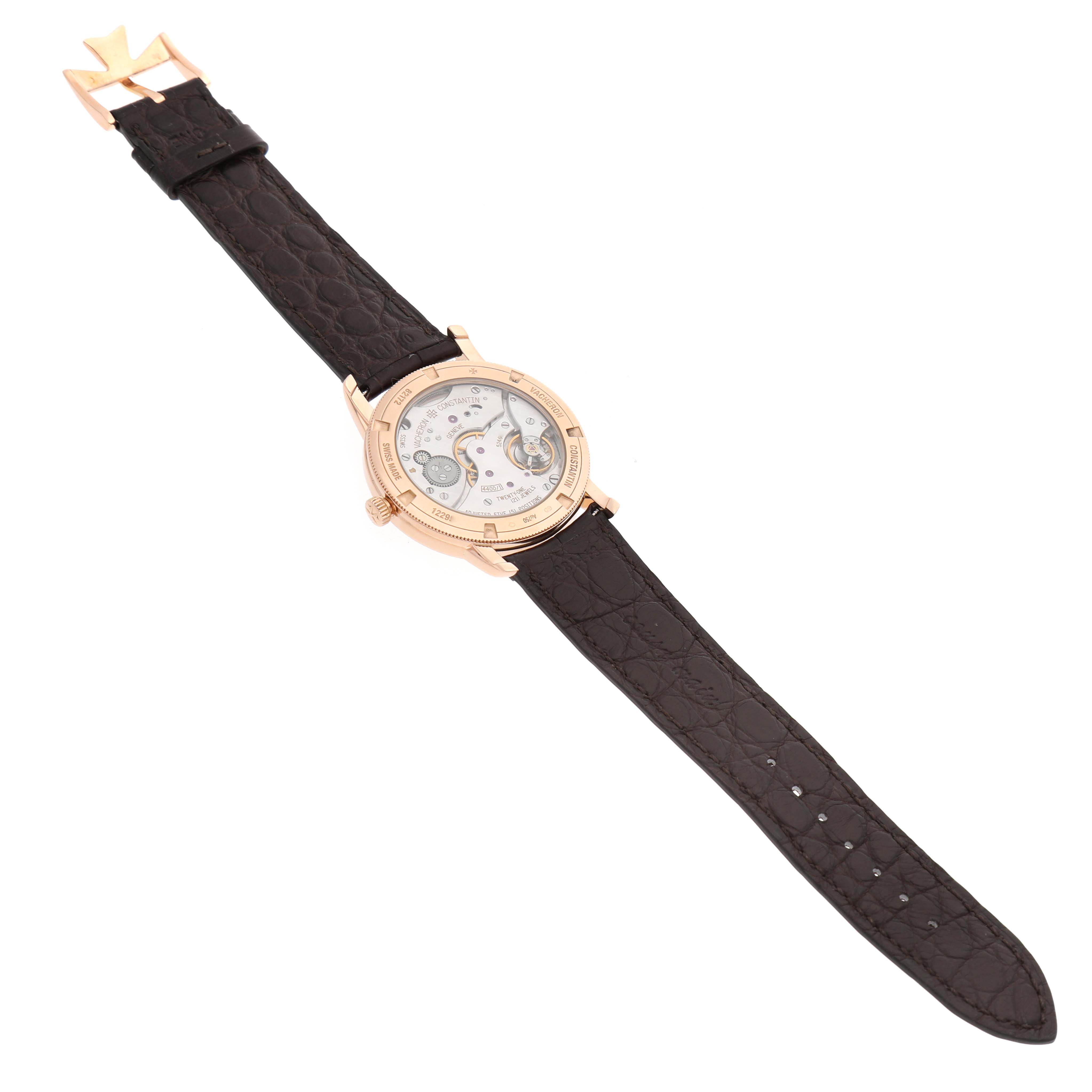 The Vacheron Constantin Traditionnelle 82172 Men's Rose Gold Silver Dial watch is shown from the back, revealing the movement and black leather strap.