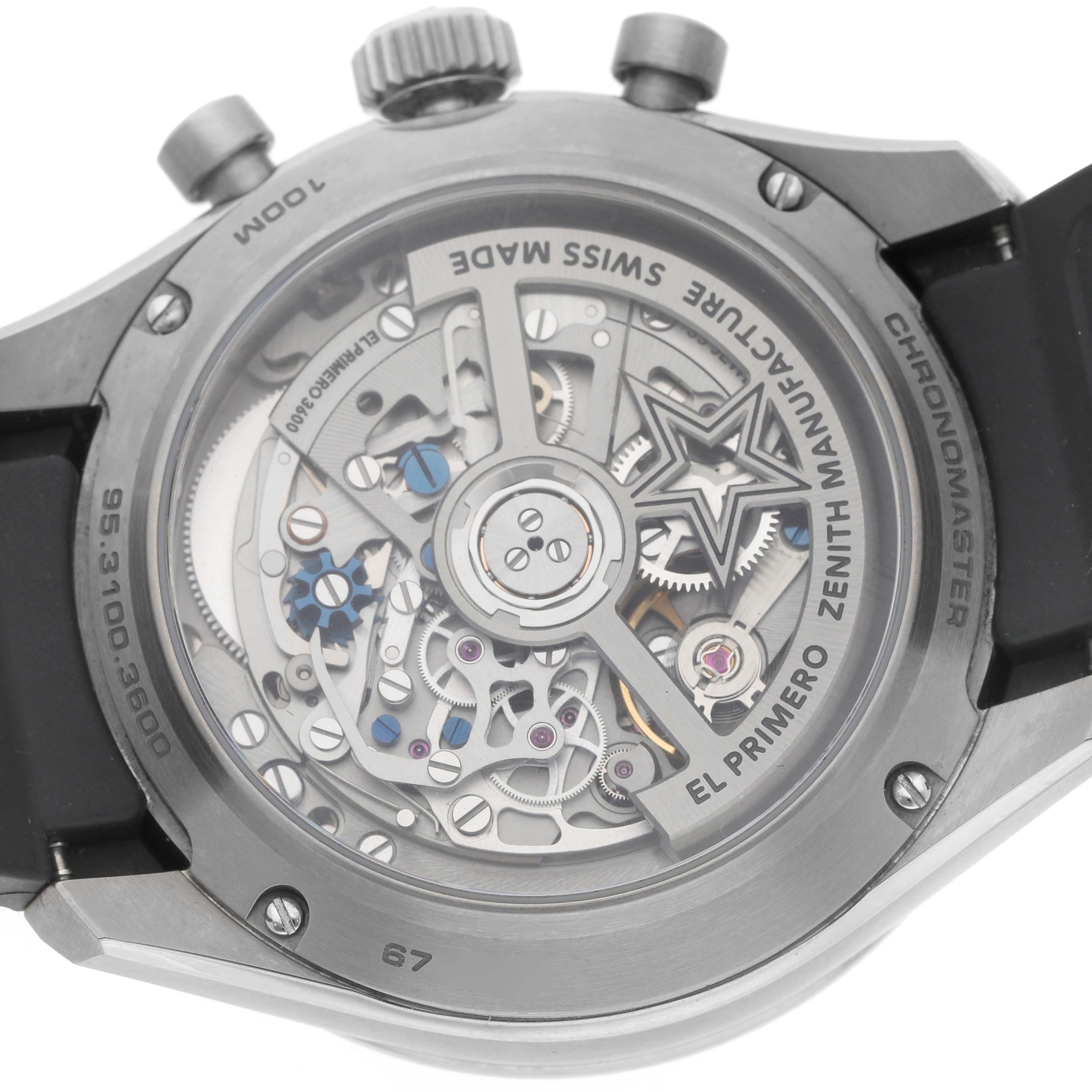 The image shows the back view of the Zenith Chronomaster 95.3100.3600 / 39.R951 Men's Titanium Silver Dial watch, highlighting its intricate movement and design details.