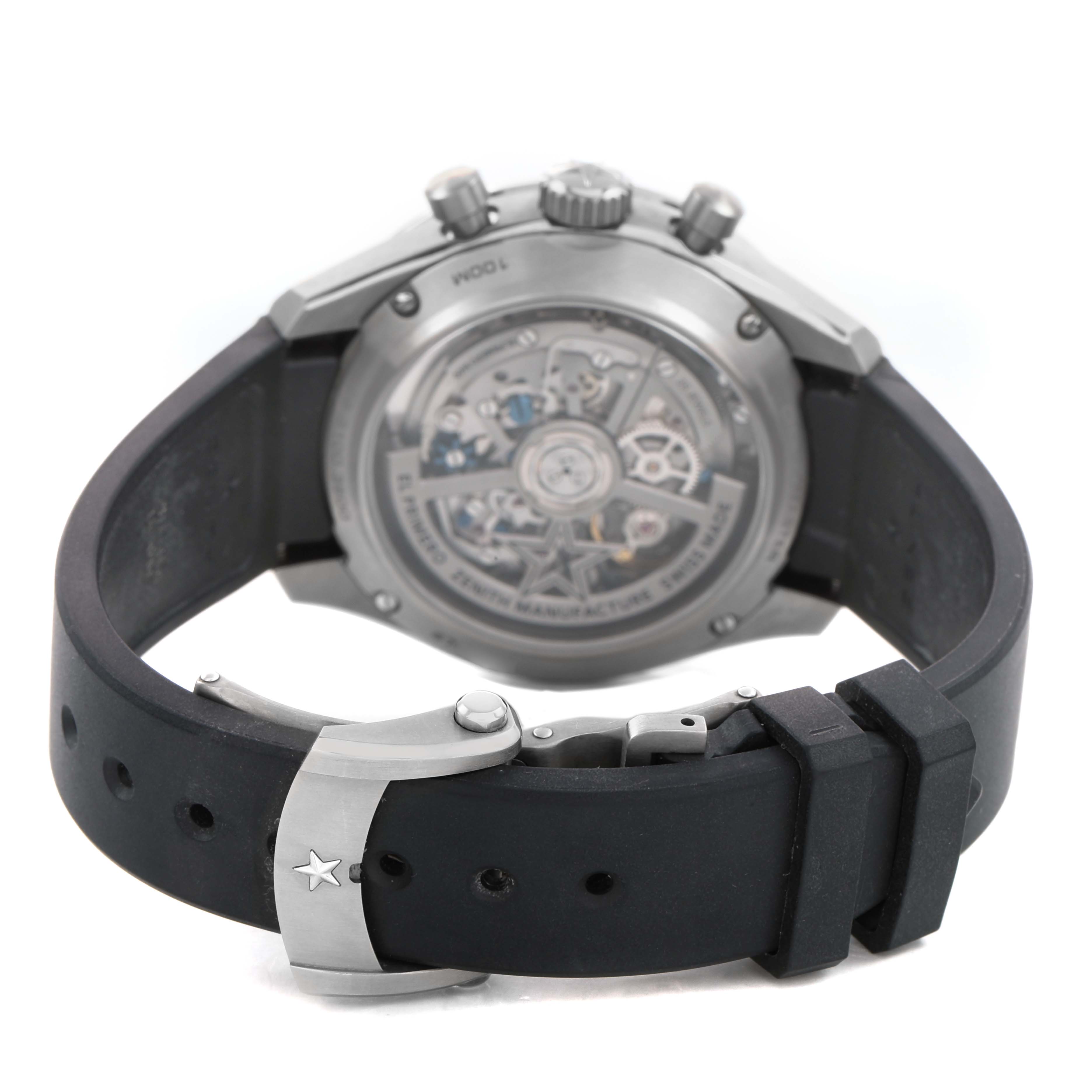 The image shows the back of the Zenith Chronomaster 95.3100.3600 / 39.R951 Men's Titanium Silver Dial watch, focusing on the transparent case back and strap clasp.