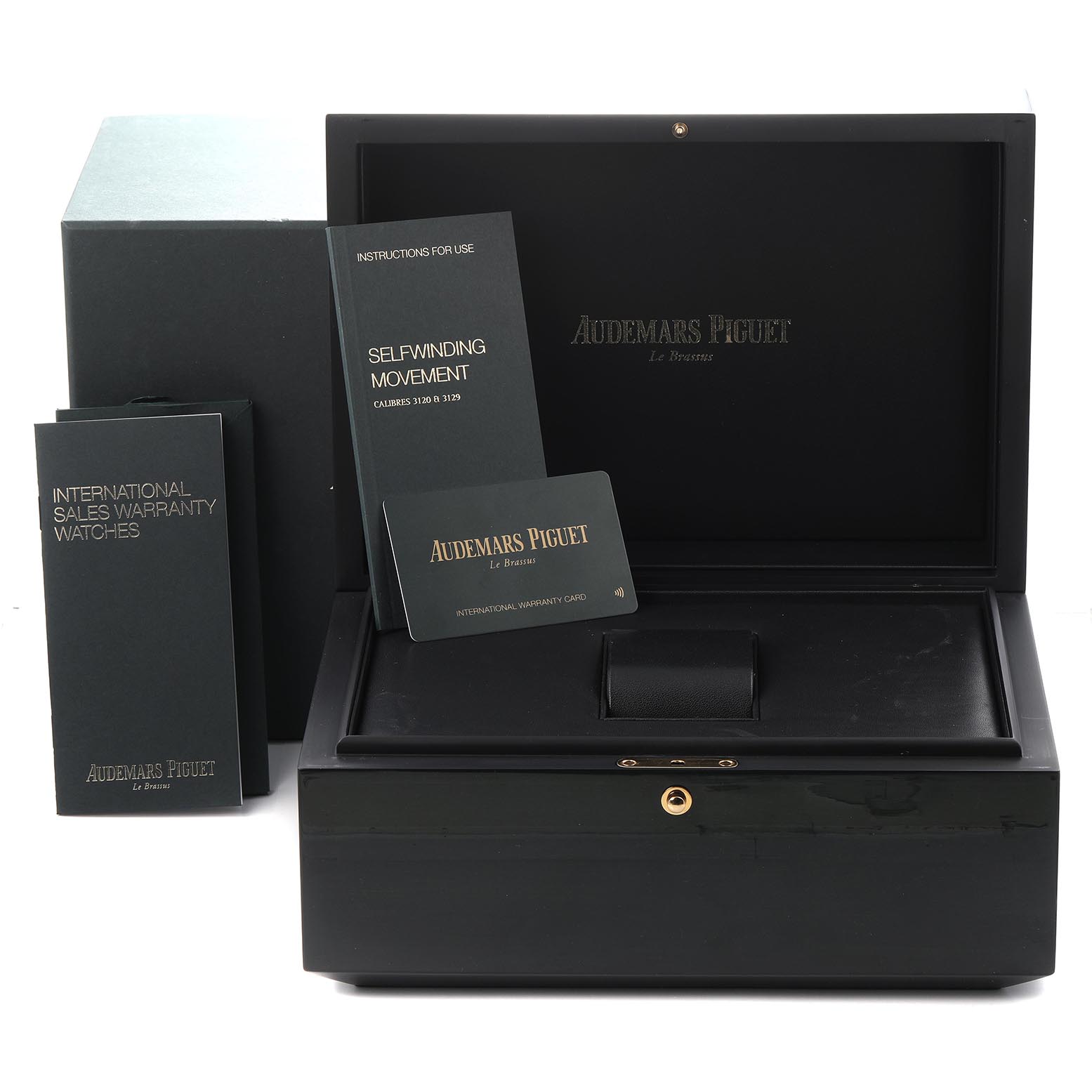 The image shows the packaging and documents for an Audemars Piguet Royal Oak 15452BC.ZY.D600CR.01 Women's White Gold Purple Dial 15452BC.ZY.D600CR.01 Women's White Gold Purple Dial, including a box, manual, and warranty card.