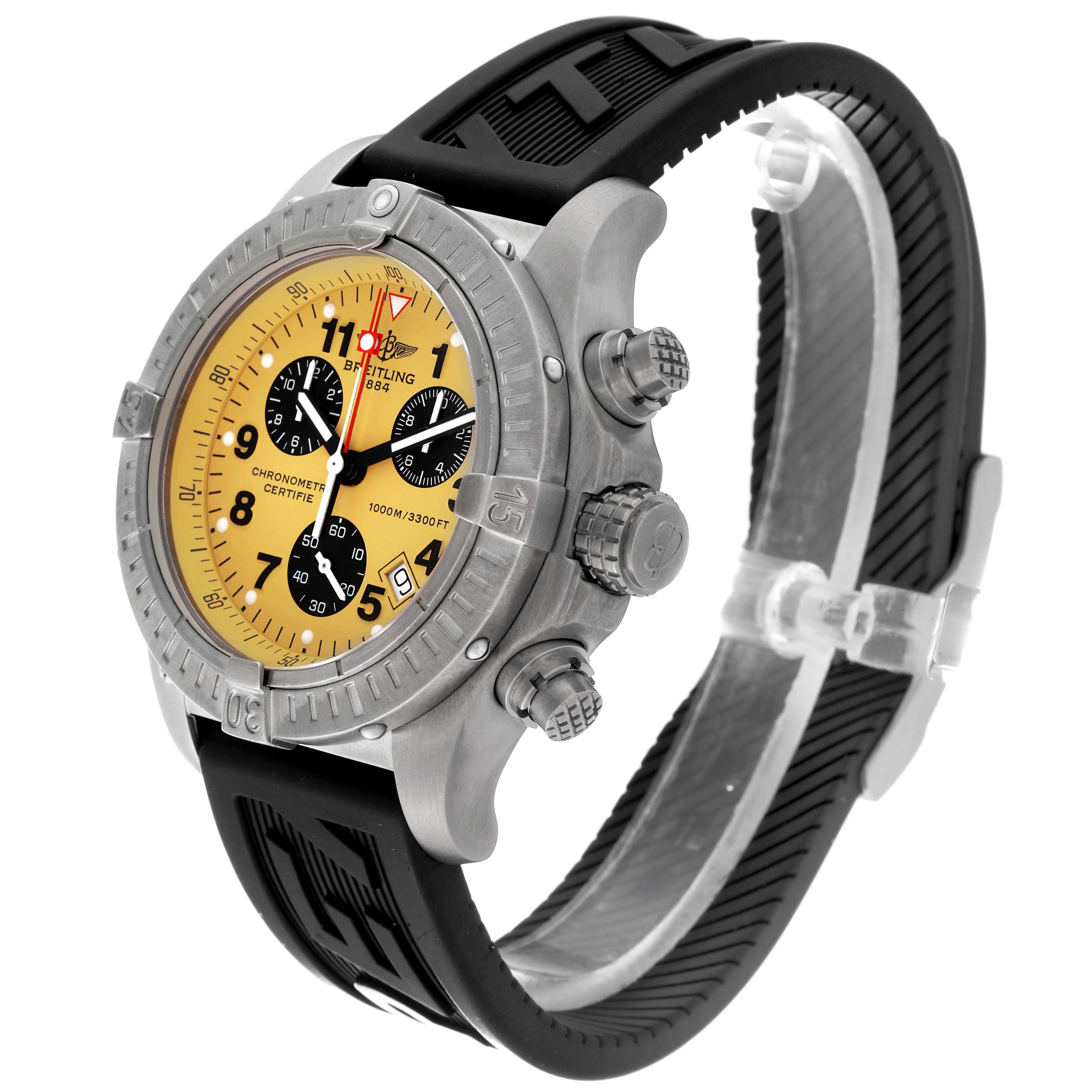 The Breitling Avenger E73360 Men's Titanium Yellow Dial E73360 Men's Titanium Yellow Dial watch is shown at a three-quarter angle showcasing its yellow dial, three subdials, and black rubber strap.