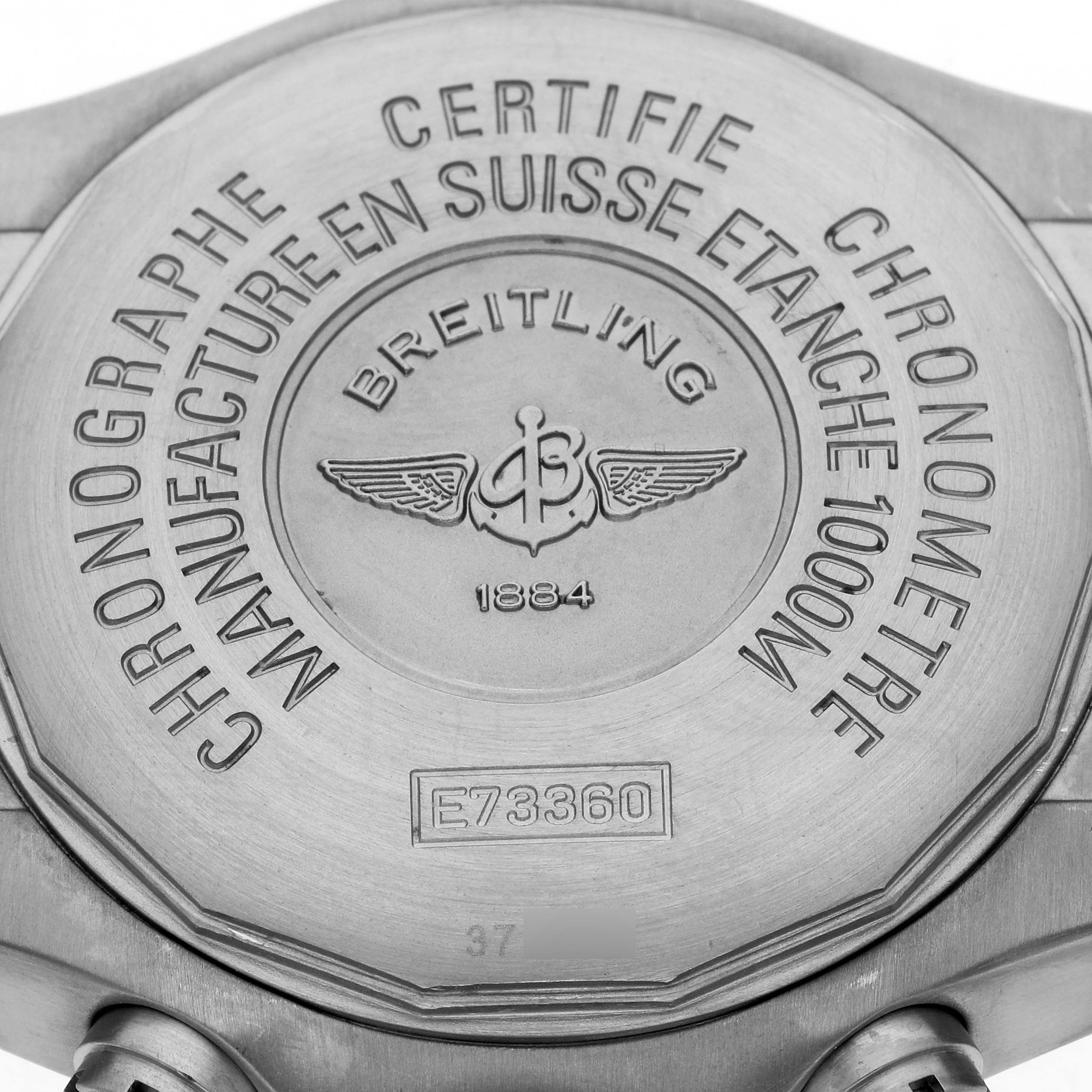 This image shows the case back of a Breitling Avenger E73360 Men's Titanium Yellow Dial E73360 Men's Titanium Yellow Dial watch, highlighting model and certification details.