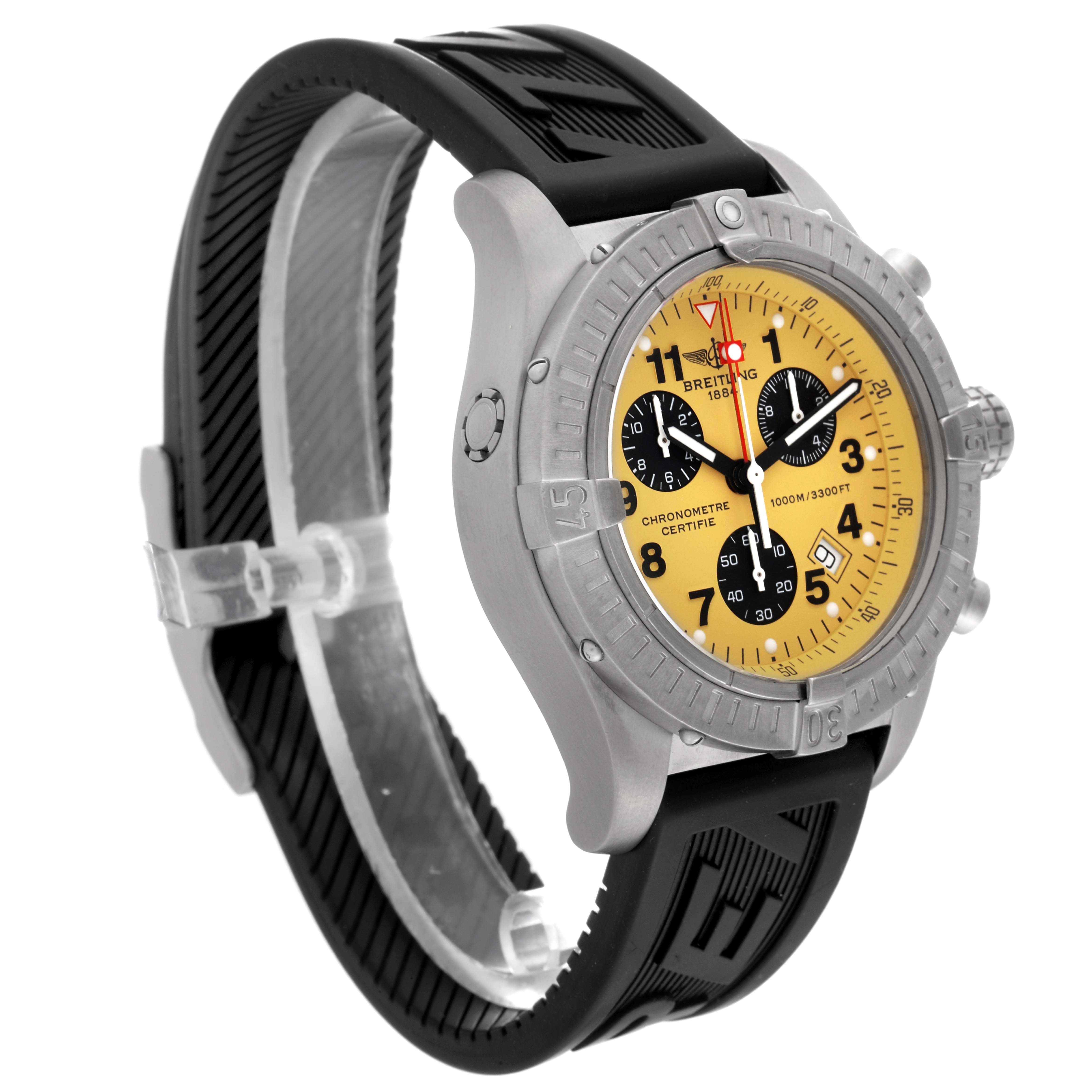The image shows a Breitling Avenger E73360 Men's Titanium Yellow Dial E73360 Men's Titanium Yellow Dial watch at an angle highlighting its yellow dial, subdials, bezel, and black strap.