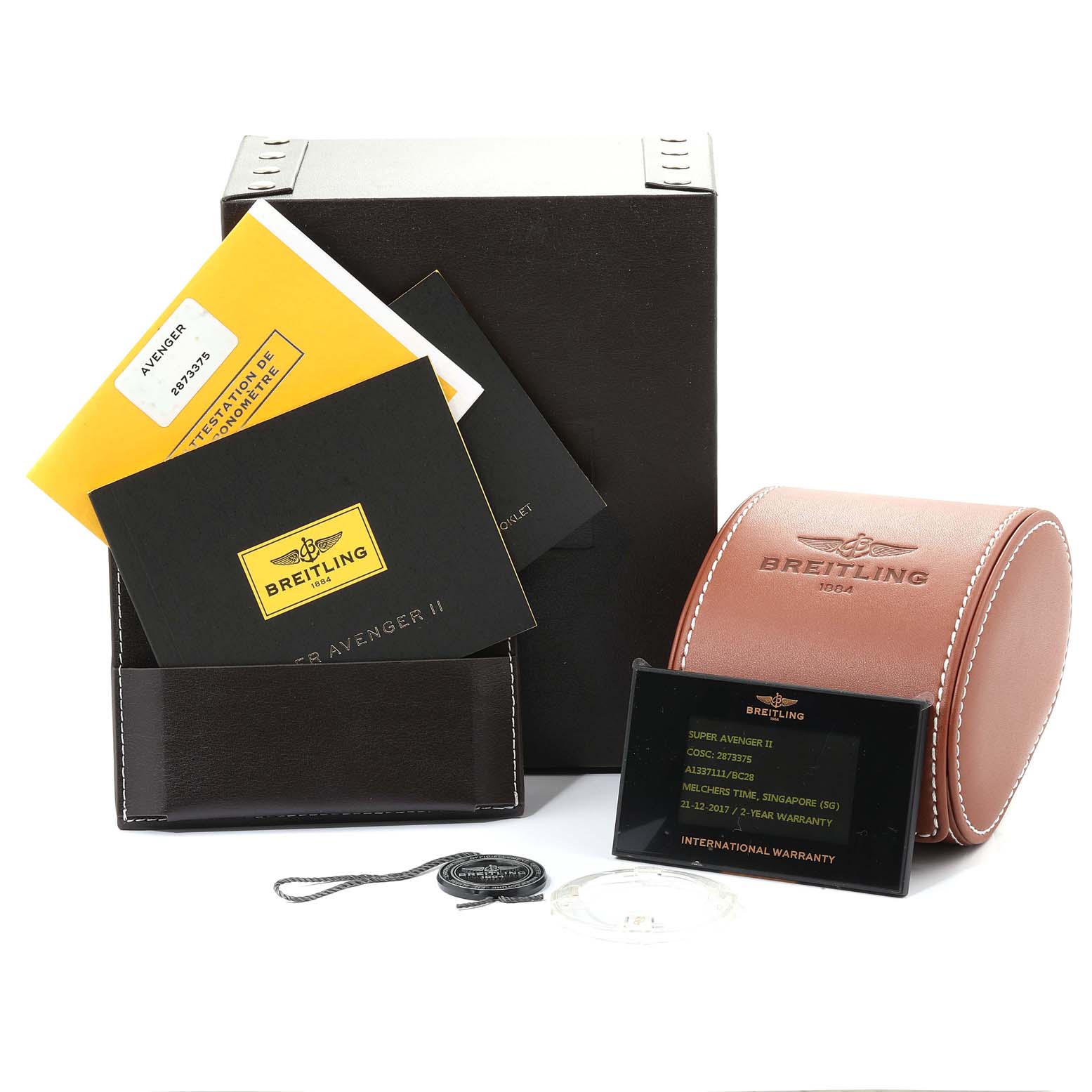 The image shows a Breitling Avenger A13371 Men
s Stainless Steel Black Dial A13371 Men
s Stainless Steel Black Dial watch
s box with manuals, warranty card, and a brown leather watch case.