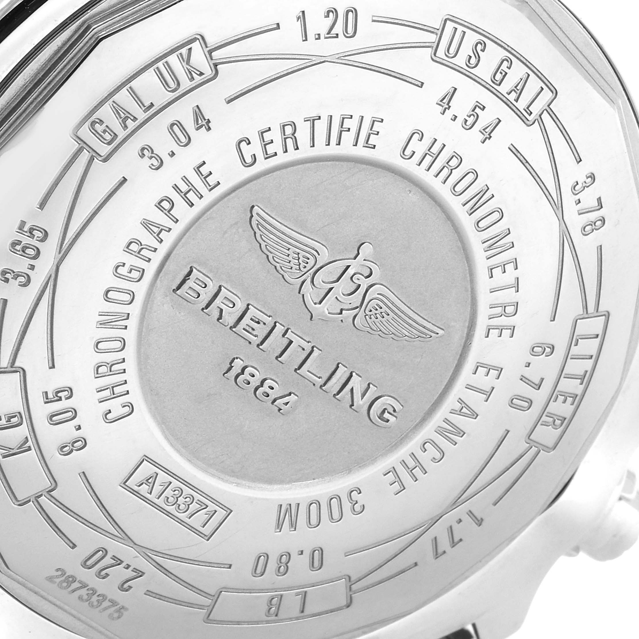 The image shows the back case of a Breitling Avenger A13371 Men
s Stainless Steel Black Dial A13371 Men
s Stainless Steel Black Dial watch, featuring engravings and specifications.