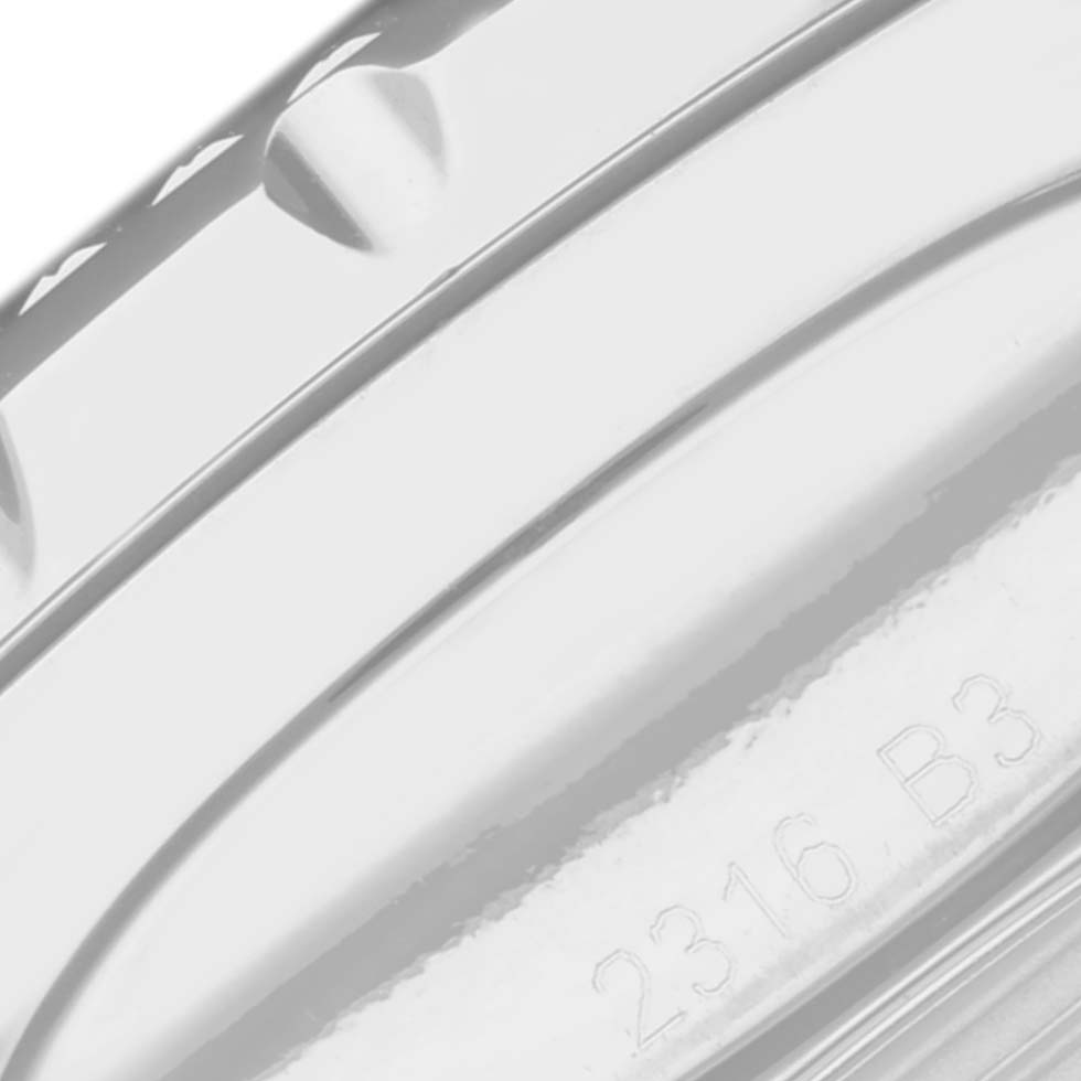 The image shows a close-up of the bezel and edge of the case of a Breitling Bentley A13362 Men's Stainless Steel Mother of Pearl Dial A13362 Men's Stainless Steel Mother of Pearl Dial model watch, with part of its serial number visible.