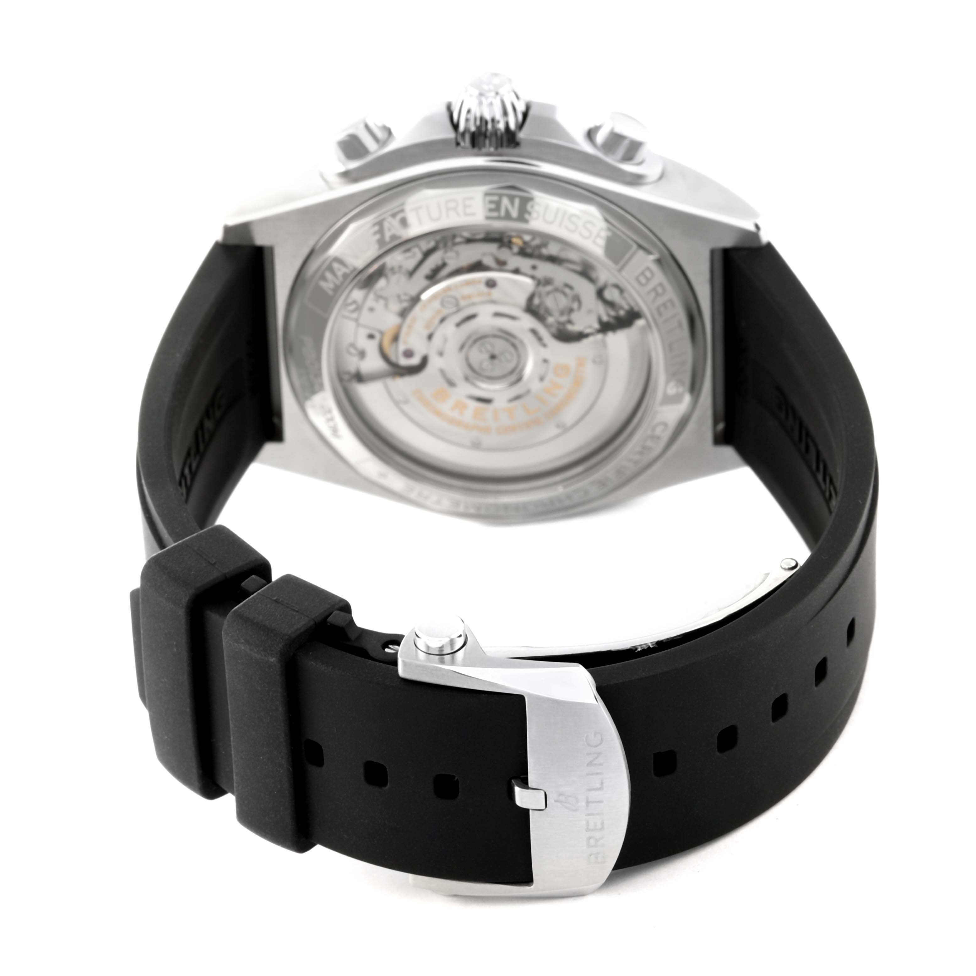 The image shows the back view of the Breitling Chronomat PB0134 Men
s Stainless Steel Blue Dial PB0134 Men
s Stainless Steel Blue Dial watch, highlighting its transparent case back and black strap with a clasp.