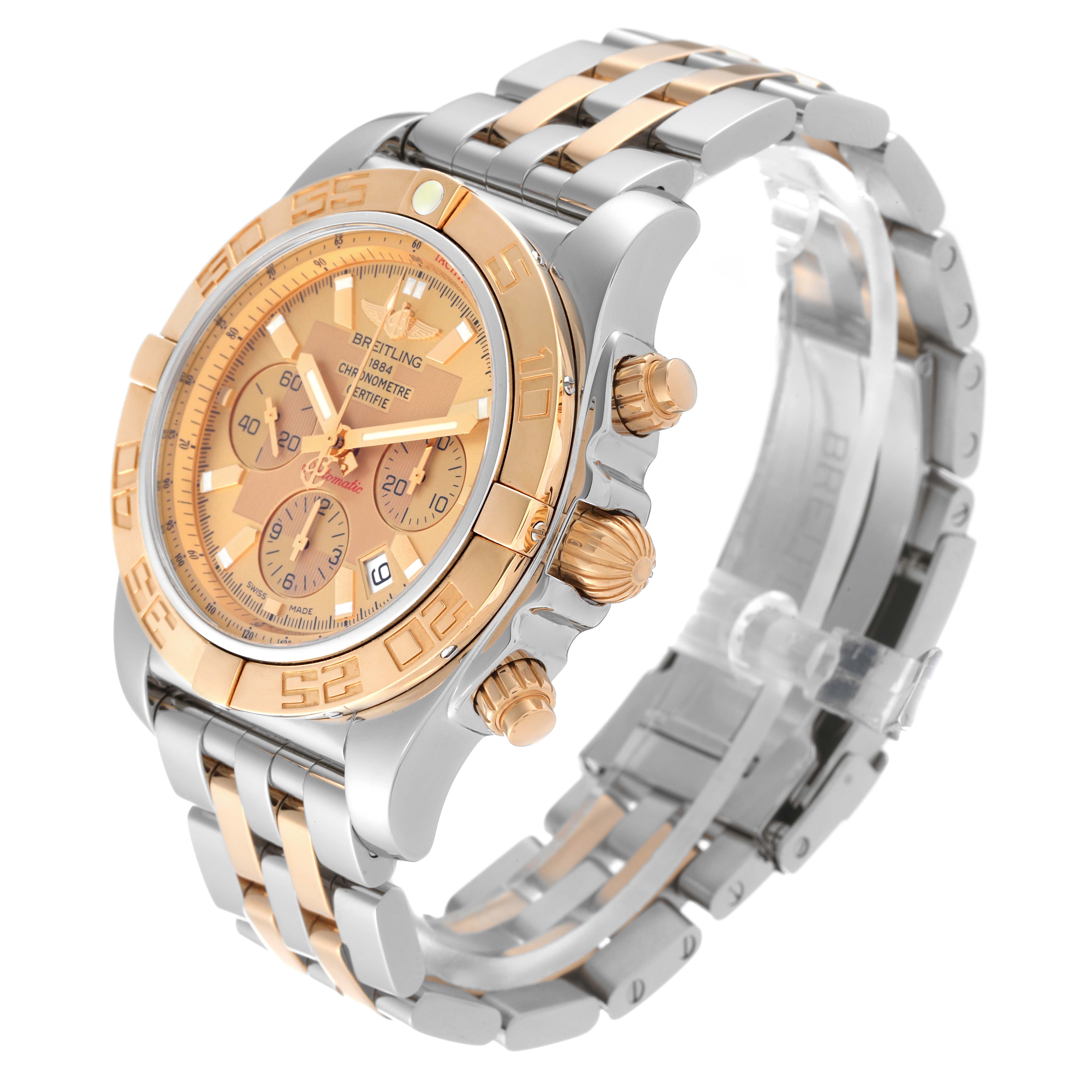 The Breitling Chronomat CB011012/B957 Men's Stainless Steel Champagne Dial CB011012/B957 Men's Stainless Steel Champagne Dial watch is shown at an angled view, highlighting its gold dial, bezel, chronograph subdials, and two-tone bracelet.