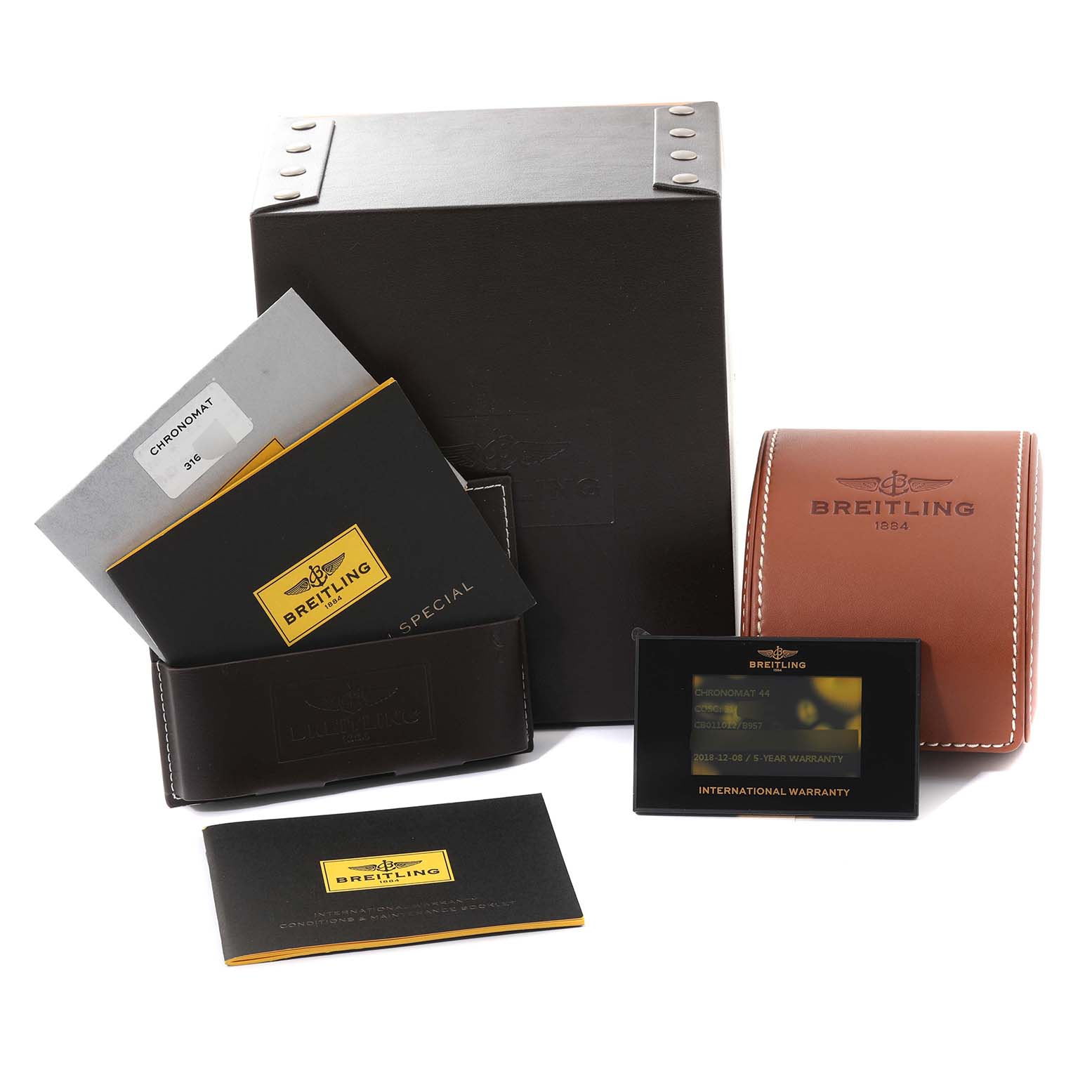 The image shows the packaging and accessories for a Breitling Chronomat CB011012/B957 Men's Stainless Steel Champagne Dial CB011012/B957 Men's Stainless Steel Champagne Dial model, including a box, leather case, manuals, and warranty card.