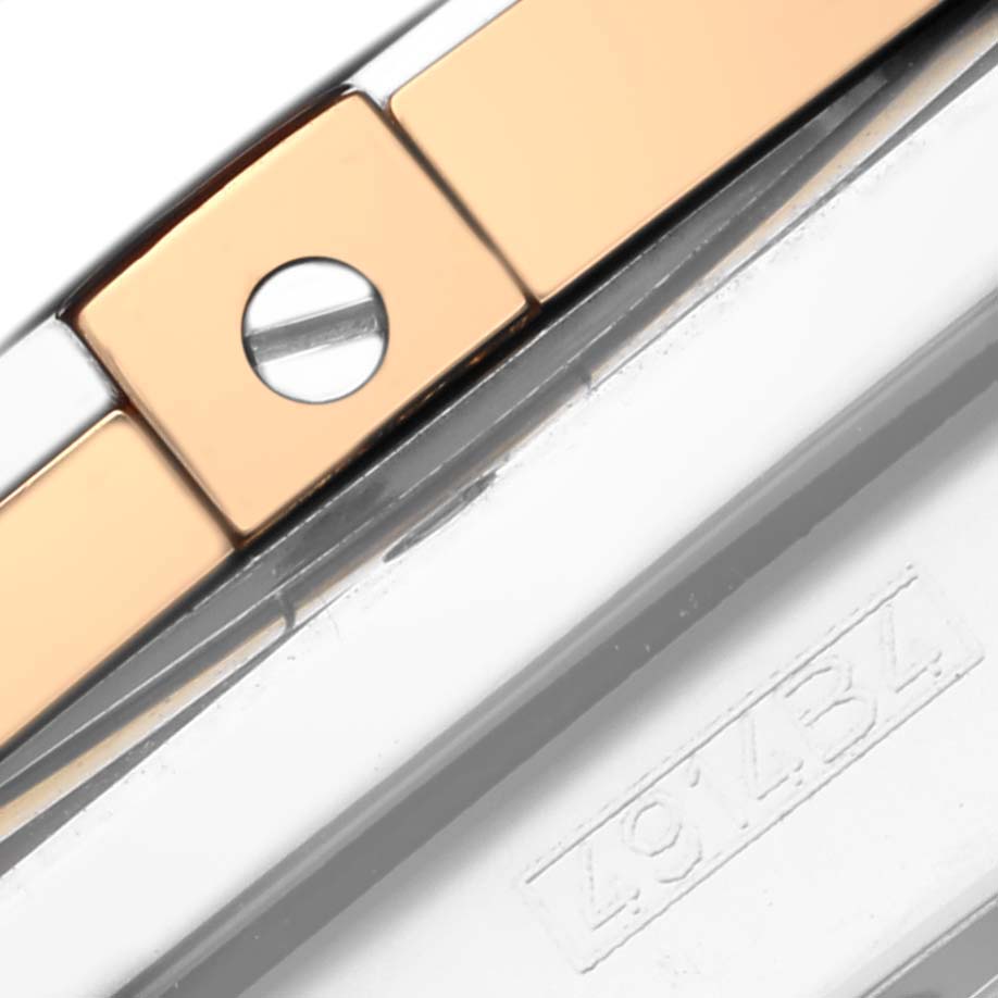 This close-up image of a Breitling Chronomat CB011012/B957 Men's Stainless Steel Champagne Dial CB011012/B957 Men's Stainless Steel Champagne Dial watch shows a section of the bracelet with a visible screw and metal links.