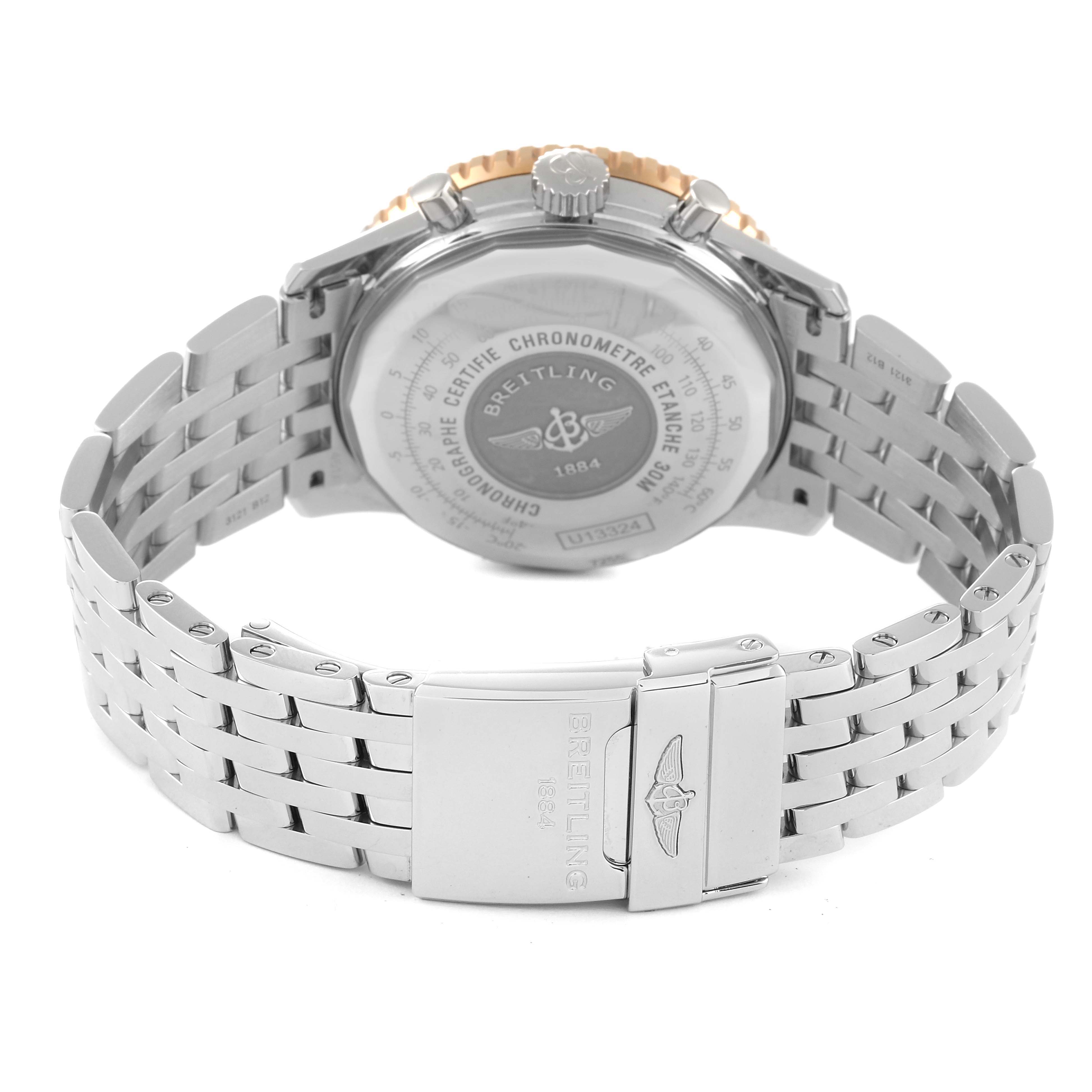 The image shows the back view of the Breitling Navitimer U13324211B1X1 Men
s Steel and Gold (two tone) Black Dial U13324211B1X1 Men
s Steel and Gold (two tone) Black Dial watch, focusing on the case back and the stainless steel bracelet with clasp.