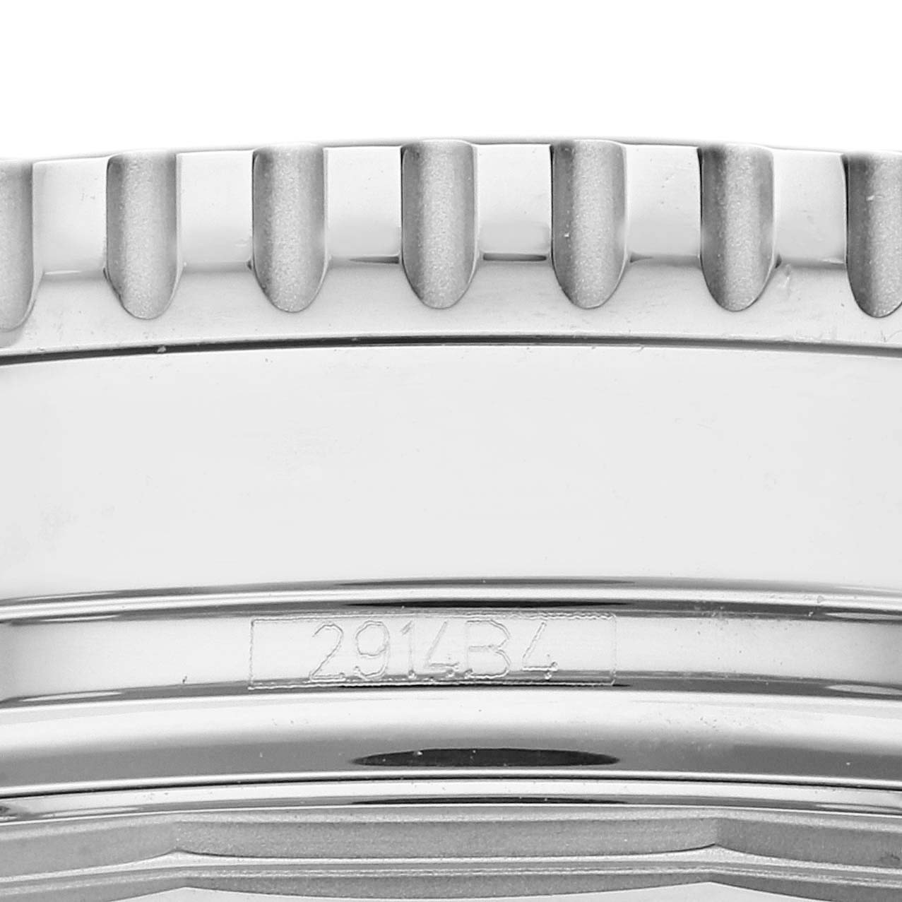 The image shows a close-up of the bezel and case side of a Breitling Navitimer A1332412/BD49 Men's Stainless Steel Black Dial A1332412/BD49 Men's Stainless Steel Black Dial, highlighting the serial number and gear-like edges.