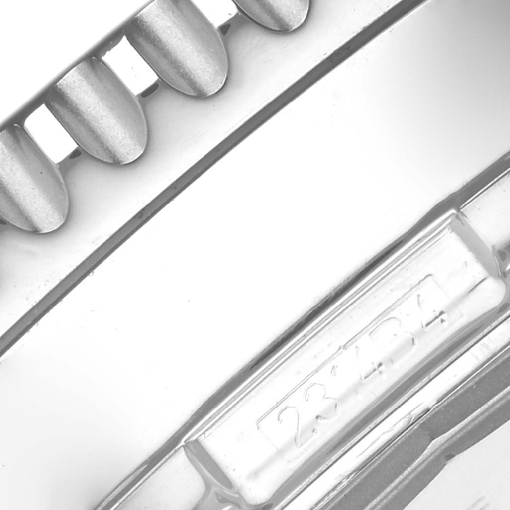 This image shows a close-up of the Breitling Navitimer A24322 Men
s Stainless Steel Black Dial A24322 Men
s Stainless Steel Black Dial
s bezel and part of the watch case with a reference number.