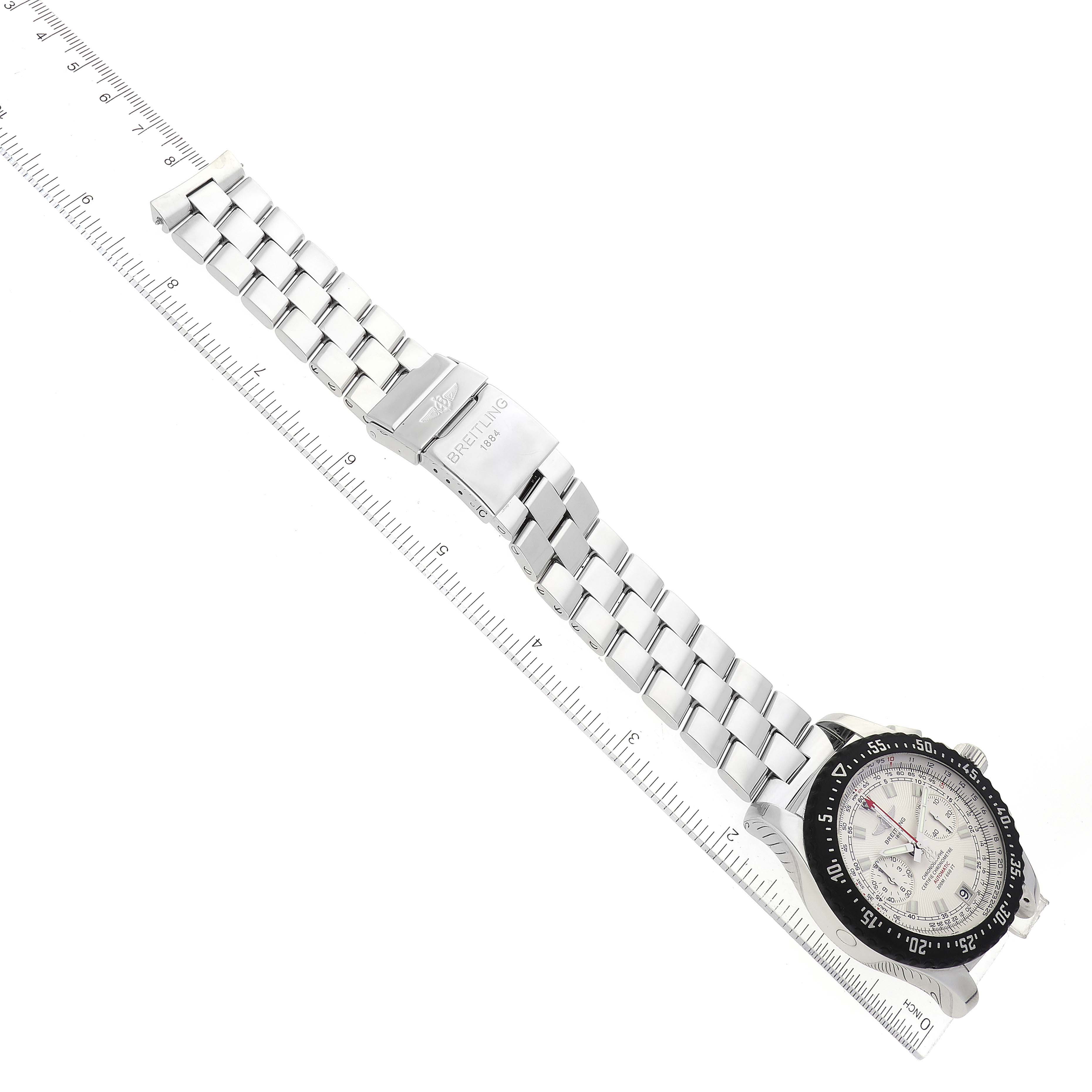 The image shows a Breitling Professional Series A27364 Men's Stainless Steel Silver Dial A27364 Men's Stainless Steel Silver Dial watch lying flat, displaying its band, clasp, and dial at an angle.