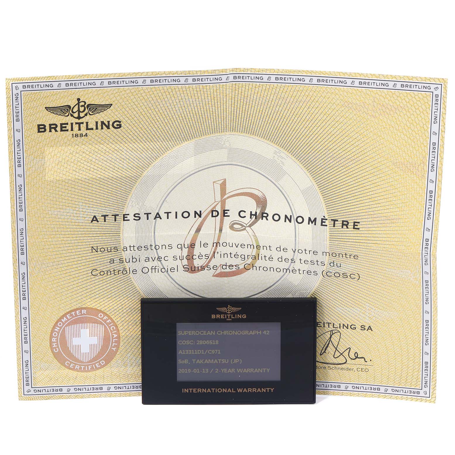 This image shows the warranty card and chronometer certificate for the Breitling Superocean A13311 Men's Stainless Steel Blue Dial A13311 Men's Stainless Steel Blue Dial model.