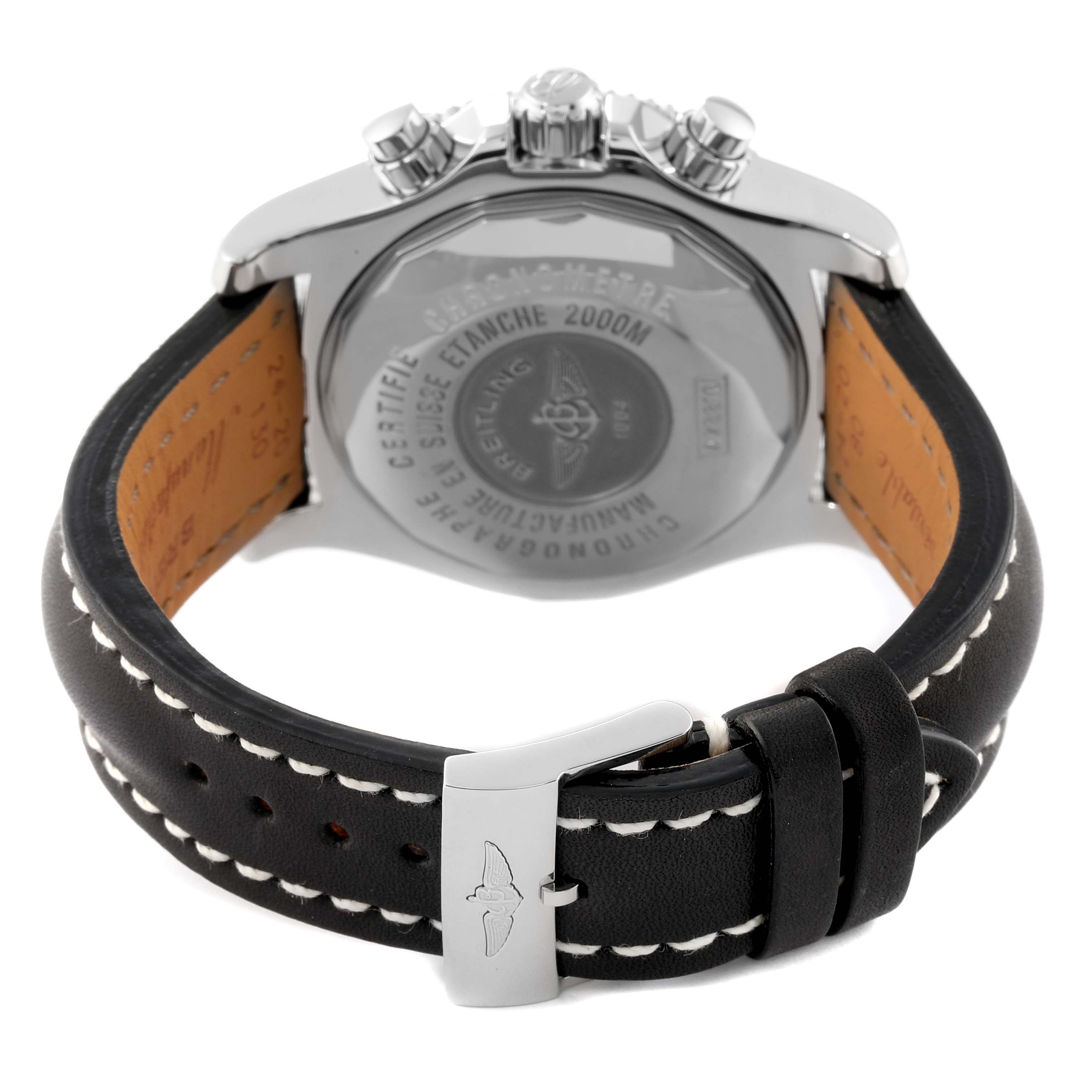 This image shows the back case and clasp of a Breitling Superocean A73310 Men's Stainless Steel Black Dial A73310 Men's Stainless Steel Black Dial watch at an angle, displaying the leather strap and detailed markings.