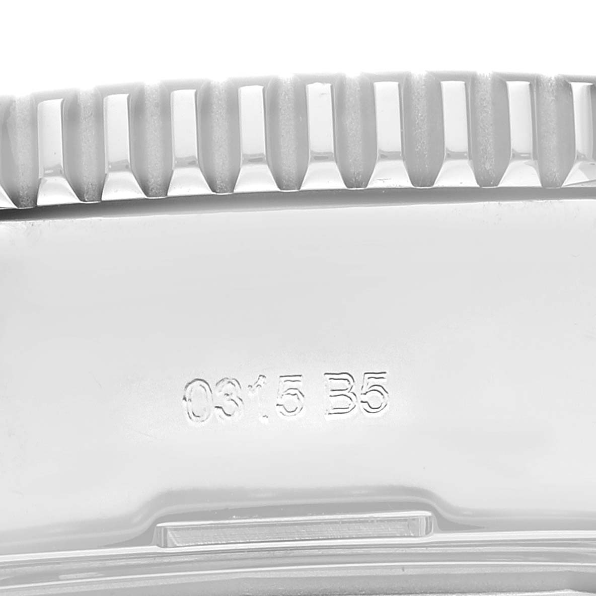 The image shows a close-up of the side view of the bezel and case of a Breitling Superocean A73310 Men's Stainless Steel Black Dial A73310 Men's Stainless Steel Black Dial watch, highlighting the serial number.