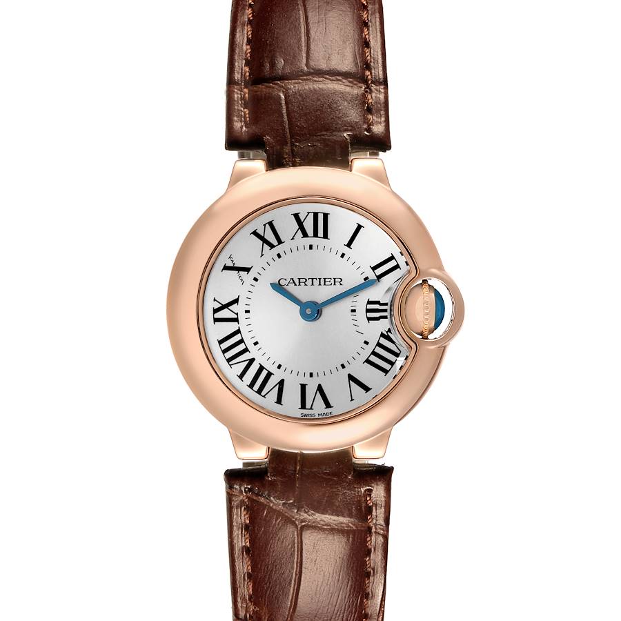 The Cartier Ballon Bleu watch is shown from a front angle, highlighting the face, Roman numerals, and brown leather strap.