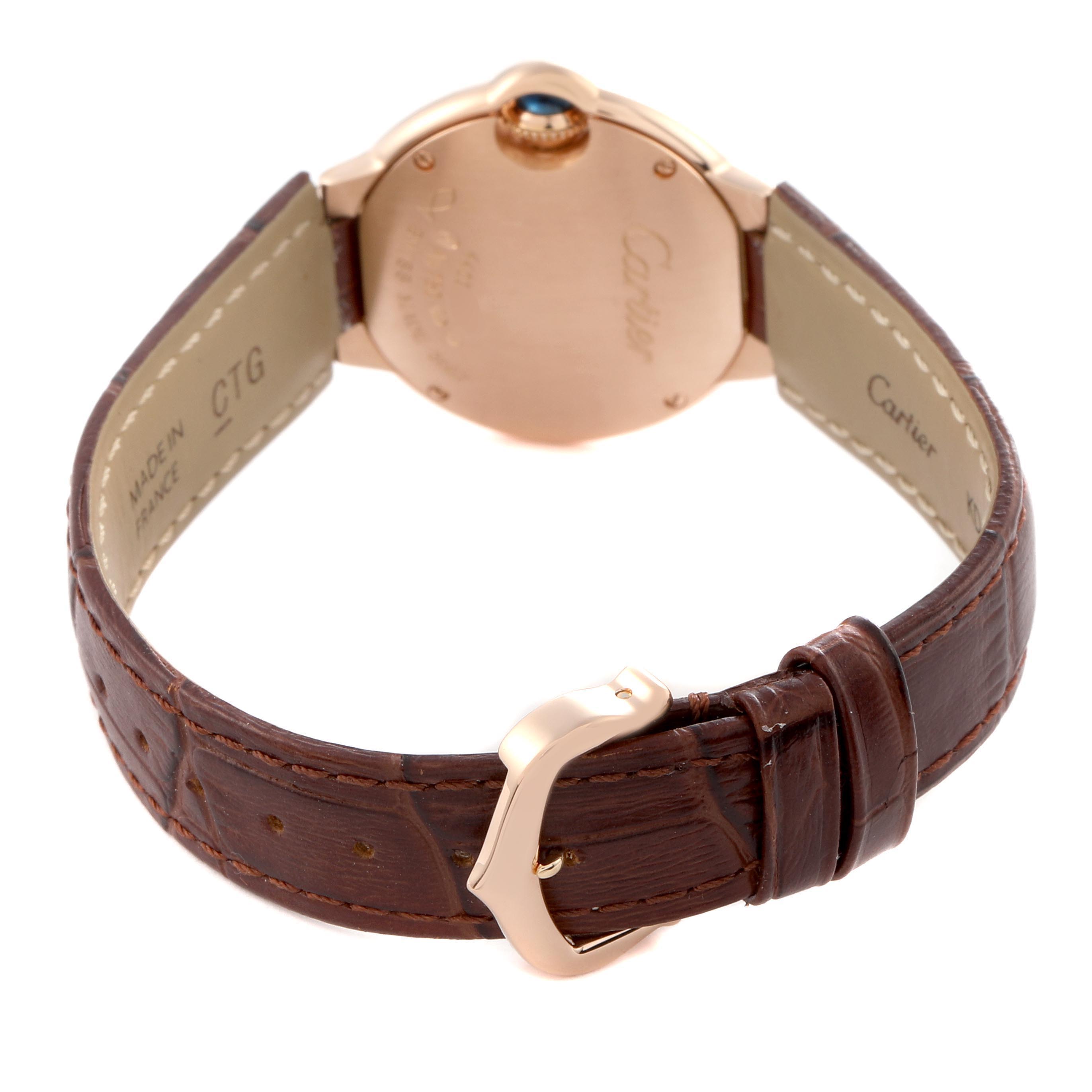 The image shows the back and side view of a Cartier Ballon Bleu W6900256 Women
s Rose Gold Silver Dial W6900256 Women
s Rose Gold Silver Dial watch, highlighting the leather strap and metal buckle.