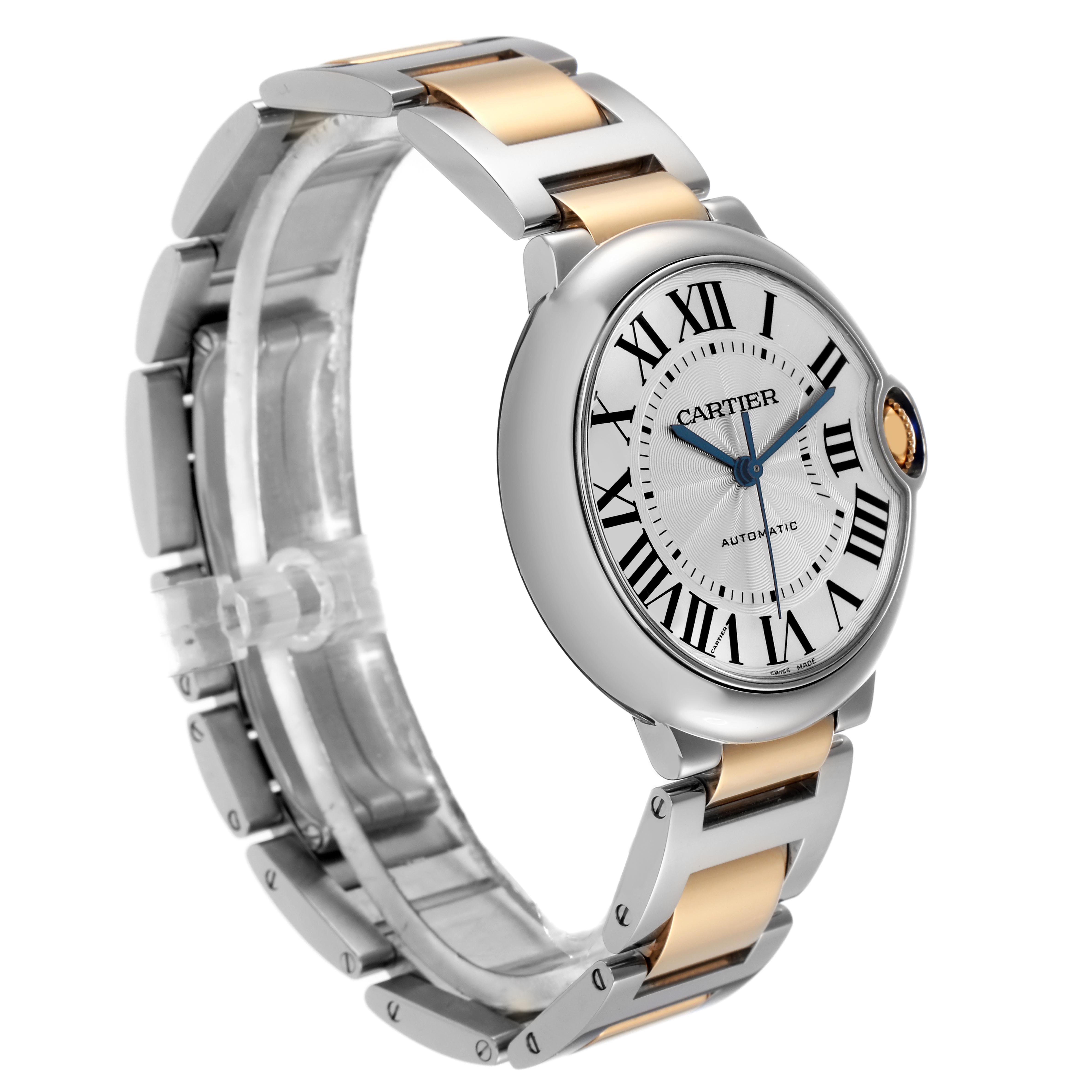 The Cartier Ballon Bleu W2BB0012 Women's Steel and Gold (two tone) Silver Dial W2BB0012 Women's Steel and Gold (two tone) Silver Dial watch is shown at a slight angle, displaying its face, bracelet, and unique crown.