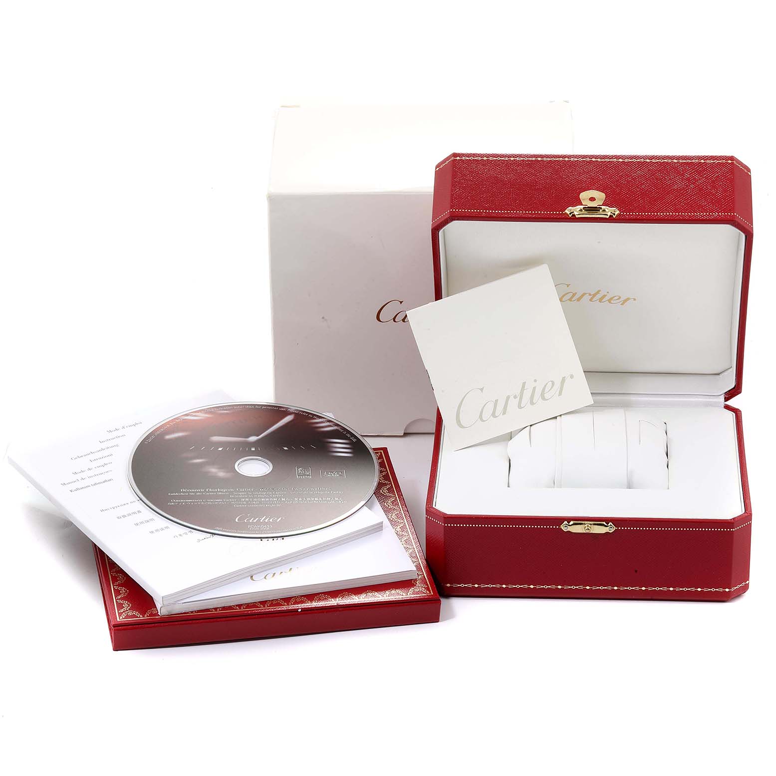 The image shows the packaging and accessories of a Cartier Ballon Bleu WE902073 Women
s Stainless Steel Silver Dial WE902073 Women
s Stainless Steel Silver Dial watch, including a box, booklet, and CD.