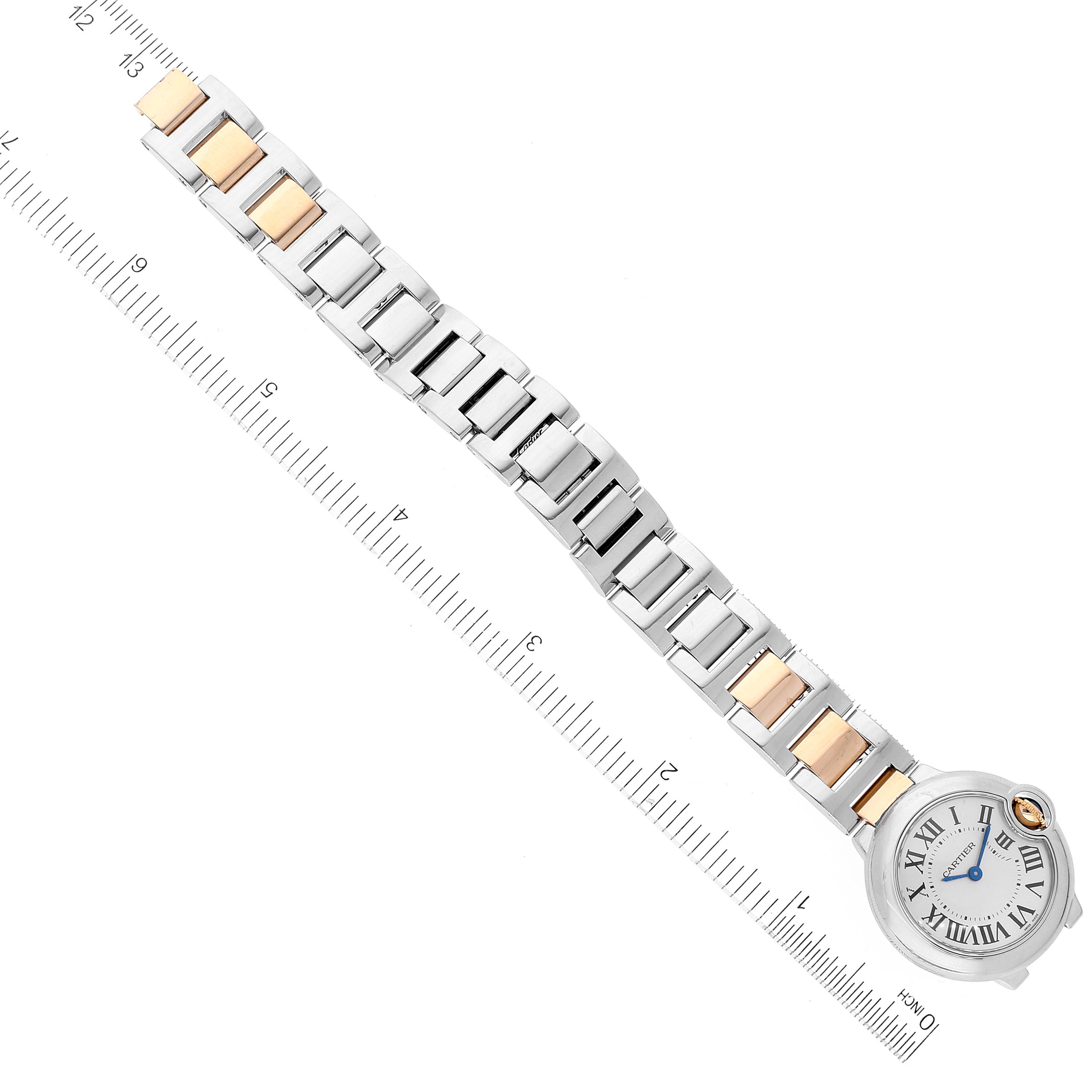 This image shows an overhead view of the Ballon Bleu model by Cartier, focusing on the full watch including its bracelet and face.