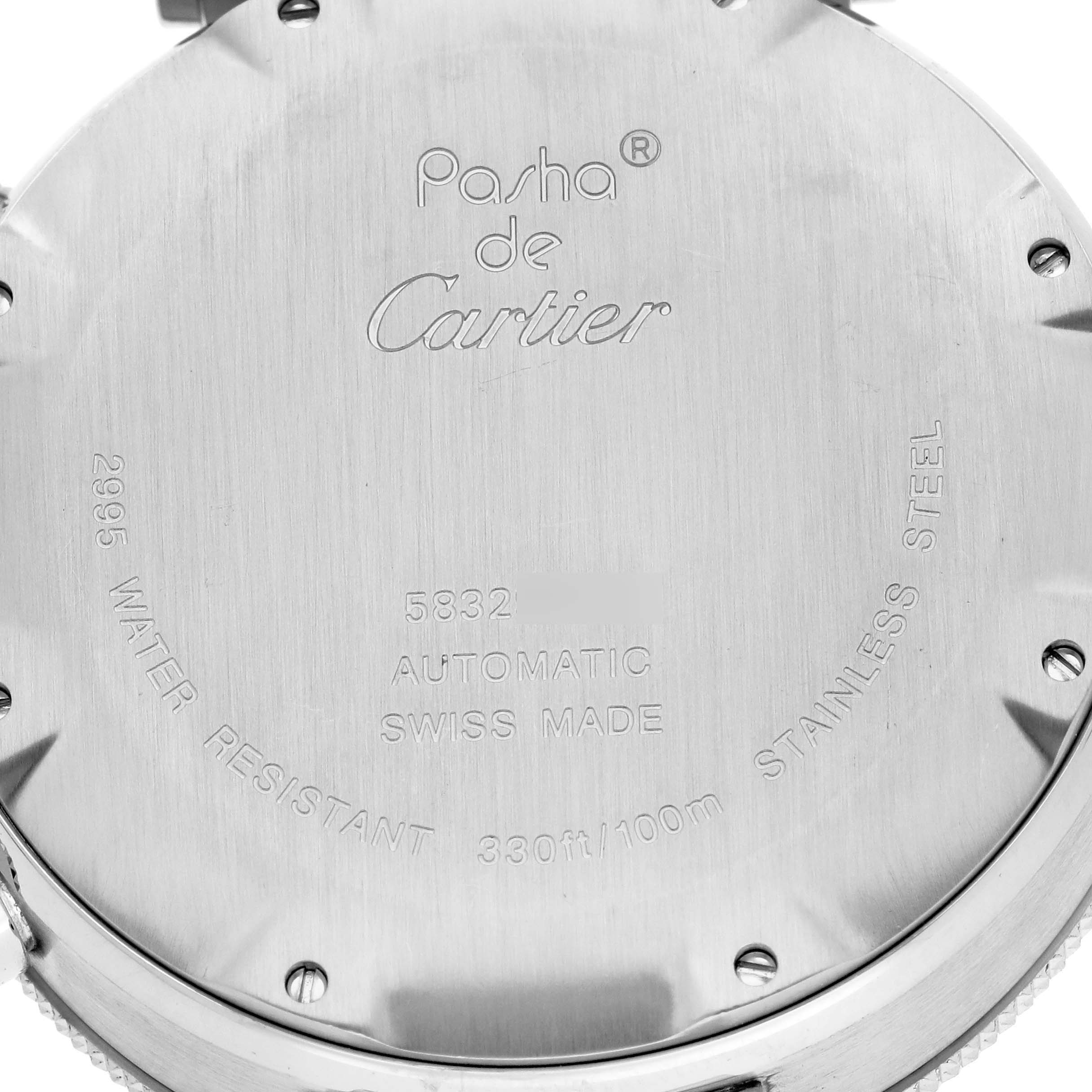 This image shows the back case of a Pasha model watch by Cartier, highlighting its inscriptions and specifications.
