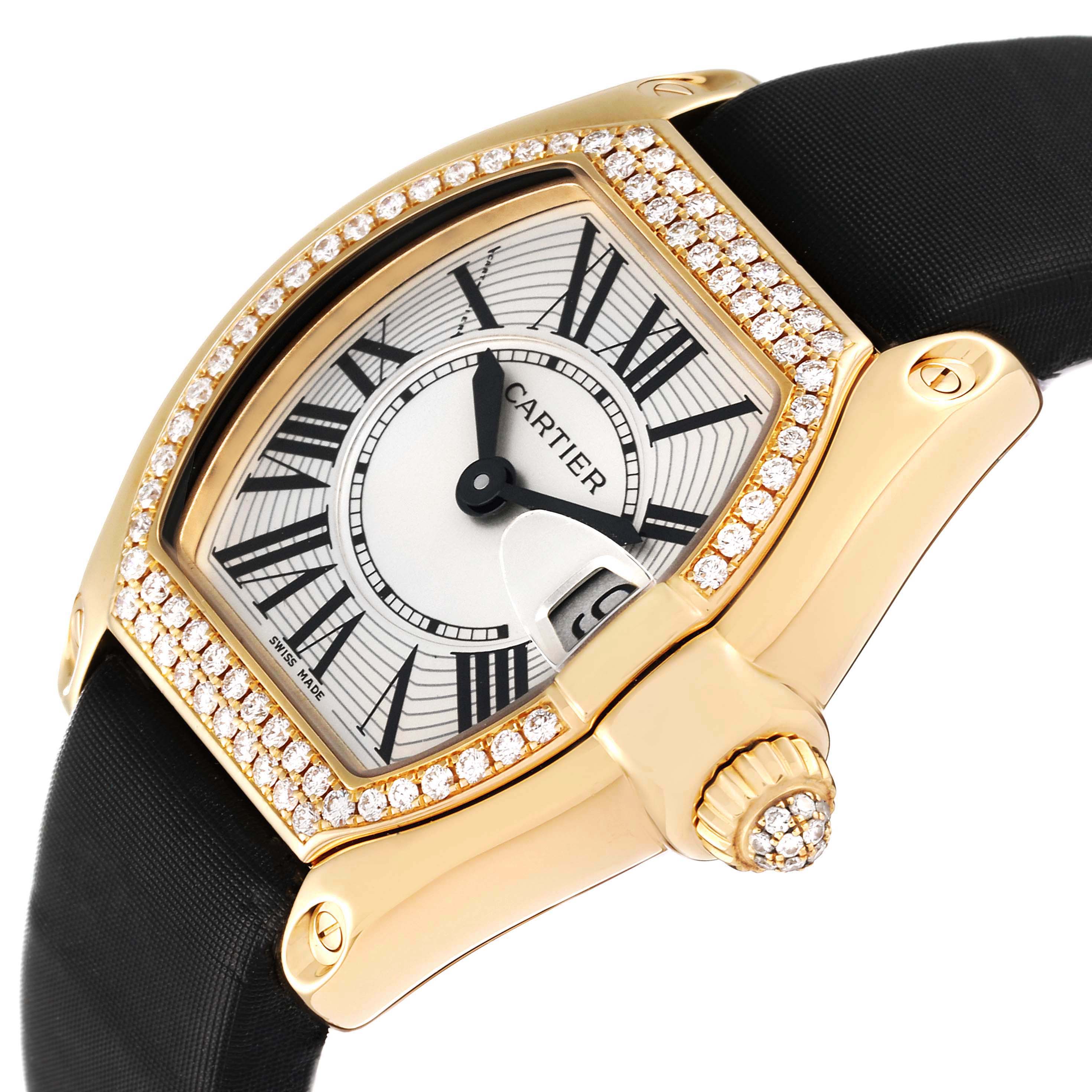 The Cartier Roadster WE500160 Women
s Yellow Gold Silver Dial WE500160 Women
s Yellow Gold Silver Dial watch is shown at an angle highlighting its diamond-studded bezel, face, and crown detail.