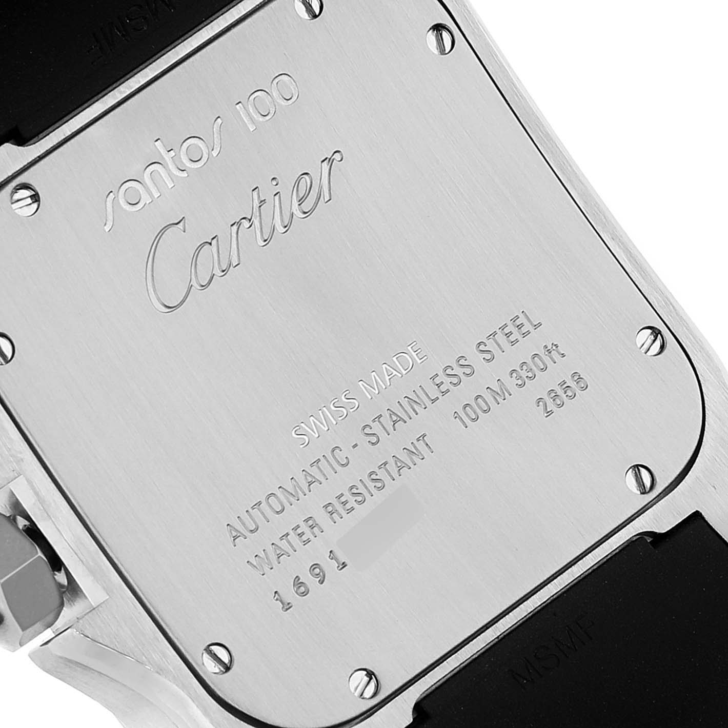 The image shows the back case of a Santos 100 watch by Cartier, highlighting engravings and part of the strap.