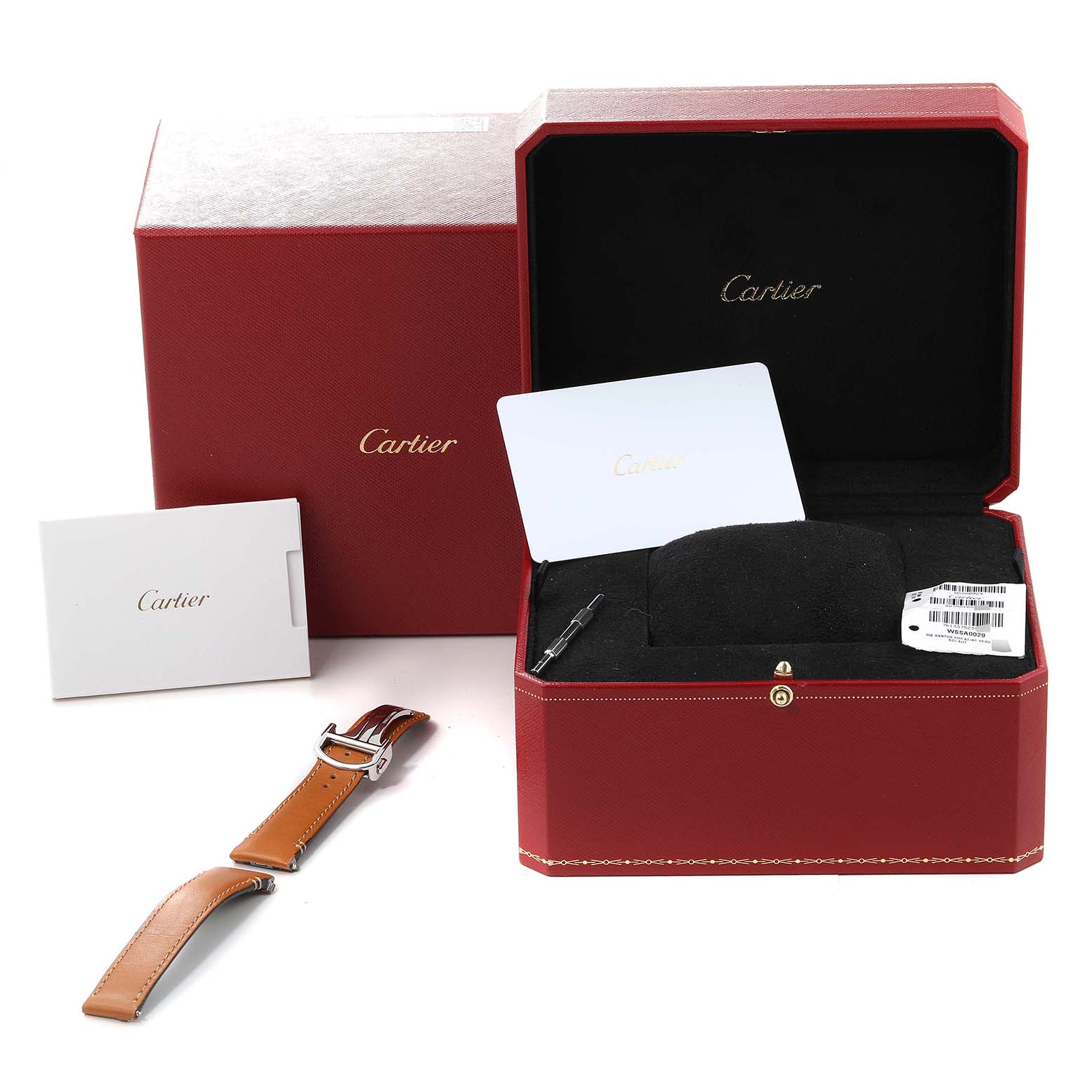 The image shows the Cartier Santos WSSA0029 Men
s Stainless Steel Silver Dial WSSA0029 Men
s Stainless Steel Silver Dial watch box, manual, an additional leather strap, and a tool for adjusting the strap.