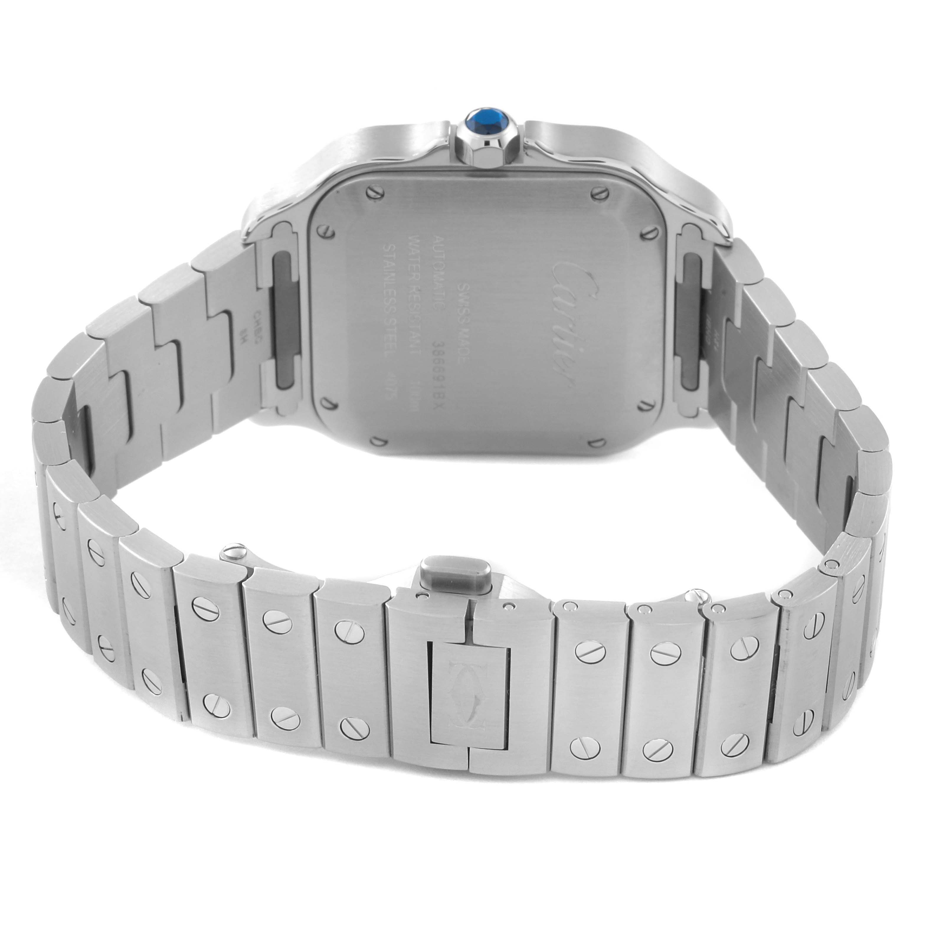 The image shows the back case and bracelet of a Santos model watch by Cartier, featuring a visible crown with a blue stone.
