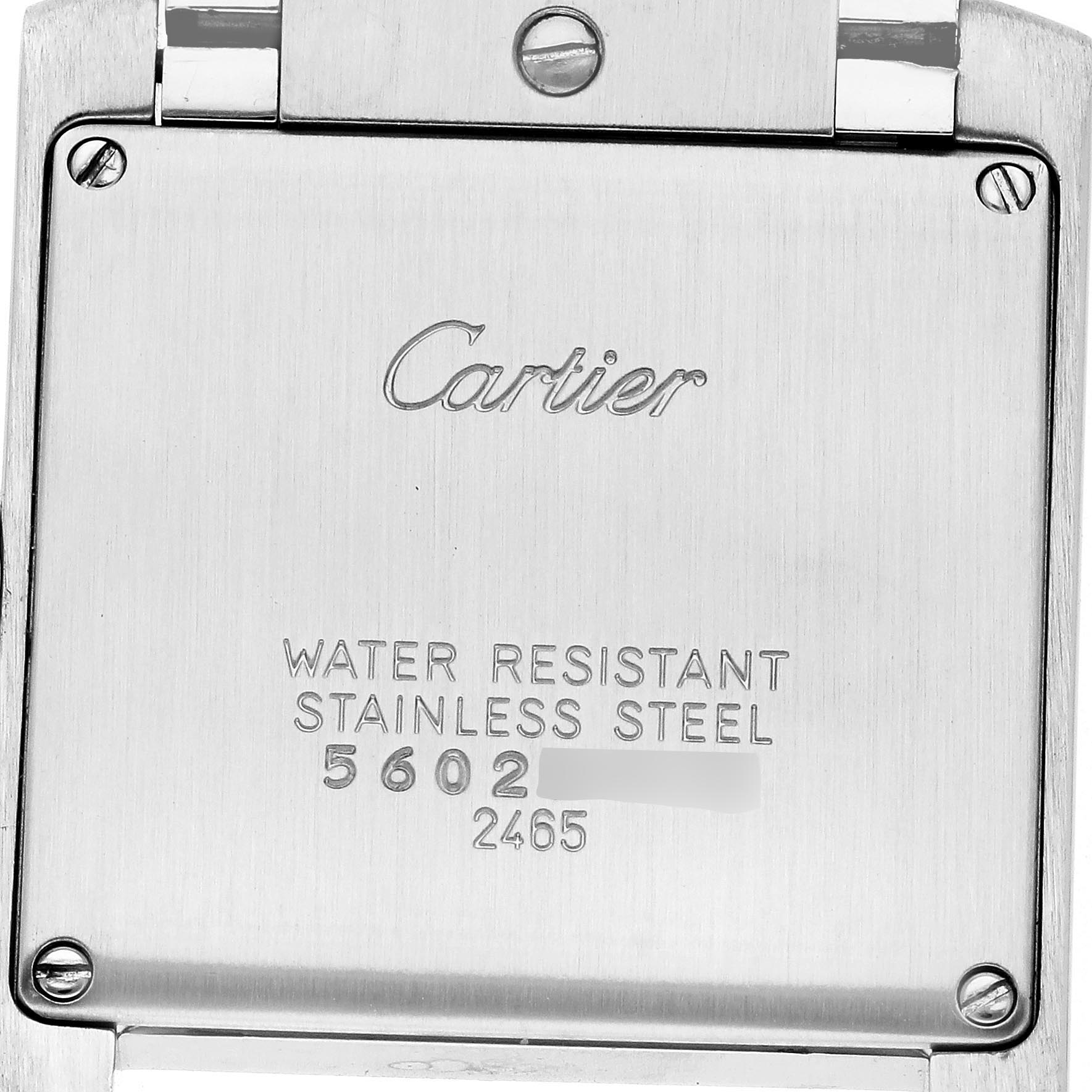 The image shows the back of a Cartier Tank Française, highlighting the stainless steel and water-resistant markings.