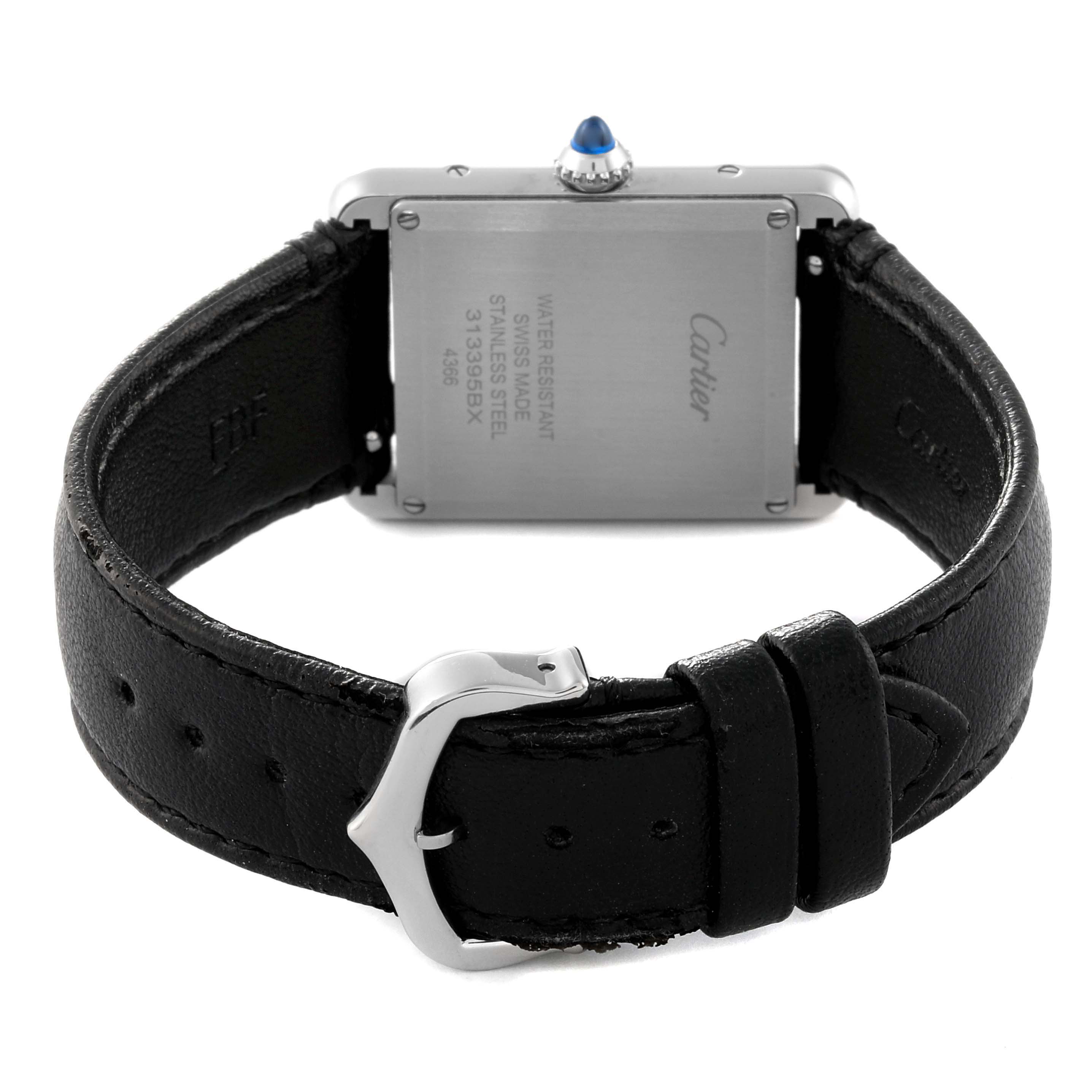 The image shows the back of a Cartier Tank Must WSTA0059 Women
s Stainless Steel Silver Dial WSTA0059 Women
s Stainless Steel Silver Dial watch, highlighting the case back, leather strap, and buckle.