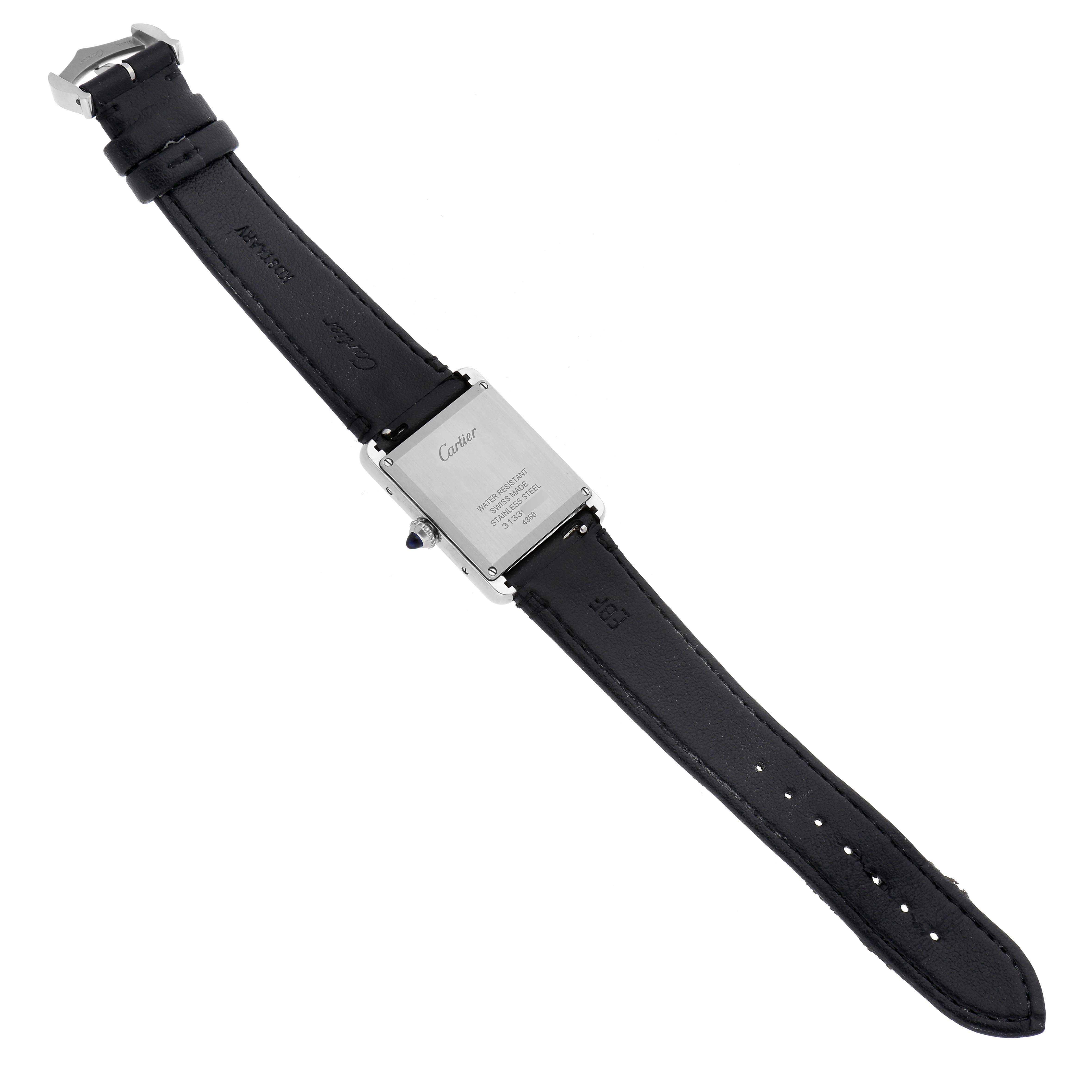 This image shows the backside and strap of a Cartier Tank Must WSTA0059 Women
s Stainless Steel Silver Dial WSTA0059 Women
s Stainless Steel Silver Dial watch at an angled overhead view.