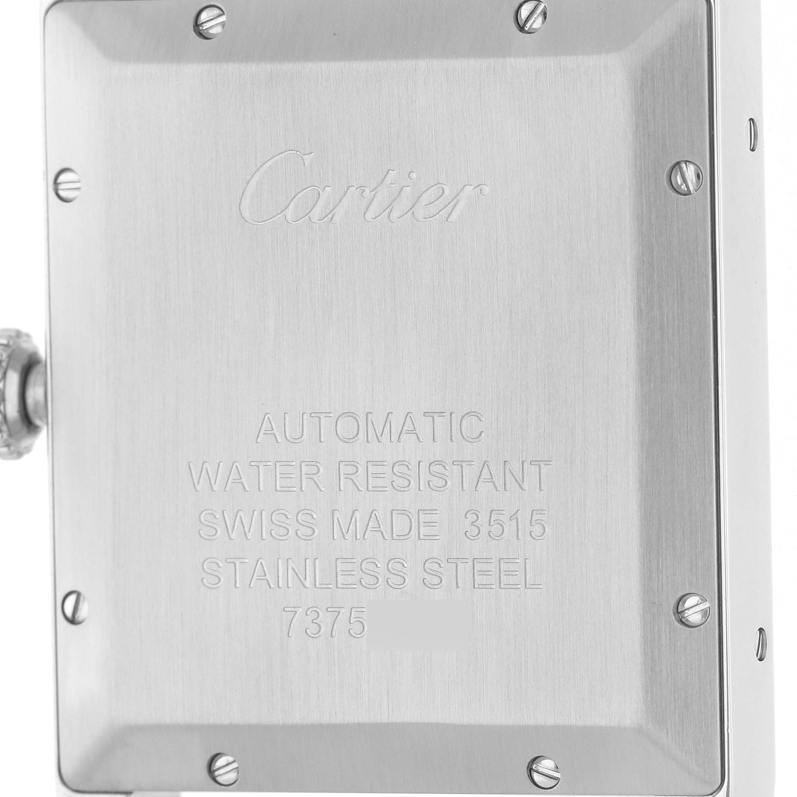 The image shows the back case of a Cartier Tank Solo W5200027 Men's Stainless Steel Silver Dial, displaying engravings and screws.